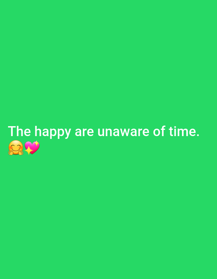 The image is a close-up, eye-level shot of a green background with white text and two emojis. The text reads "The happy are unaware of time." To the left of the text are two emojis: a smiling face with smiling eyes and a pink heart. There are no discernible features of Prešov, Slovakia, or any specific urban environment. The image appears to be a digital graphic rather than a photograph taken in a specific location.