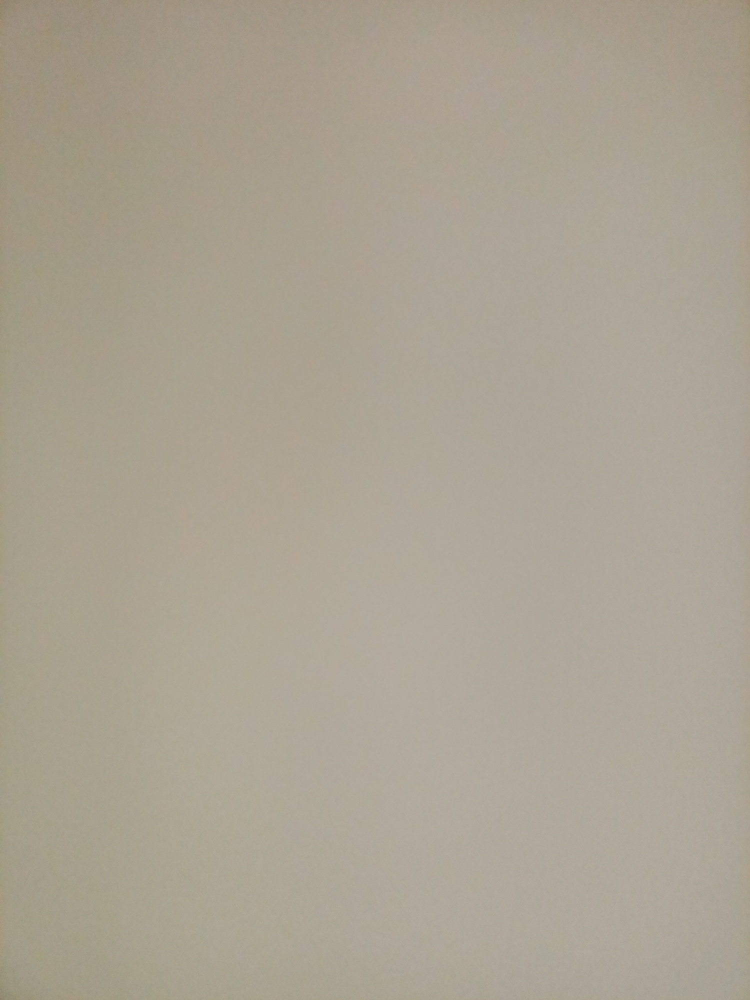 The image shows a plain, beige wall. There are no discernible objects, people, or actions depicted in the image. The scene is entirely uniform in color and texture, suggesting a simple, undecorated interior surface. There is no information available to locate this wall within Rostov-on-Don, Russia.