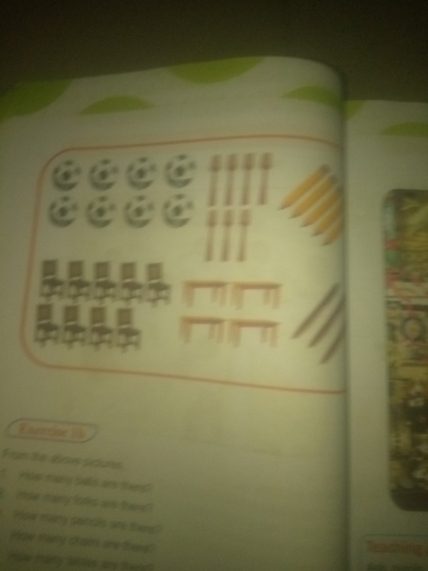 The image shows a page from a children's educational book. The left side of the page features a colorful illustration with various objects arranged in a grid-like pattern. These objects appear to be stylized representations of:
* **Balls:** Arranged in the top left section, in rows and columns.
* **Forks:** Located to the right of the balls.
* **Pencils:** Positioned in the top right section, angled.
* **Chairs:** Shown in the middle left section, in rows.
* **Tables:** Situated in the middle right section, also in rows.
Below this illustration, there is text labeled "Exercise 1b" followed by questions that refer to the pictured objects. The questions are:
1. How many balls are there?
2. How many forks are there?
3. How many pencils are there?
4. How many chairs are there?
5. How many tables are there?
The right side of the image shows a blurred section of another page, which appears to contain an illustration of a market or busy street scene.
The location of Jauro Yinu, Nigeria is not present in this image.