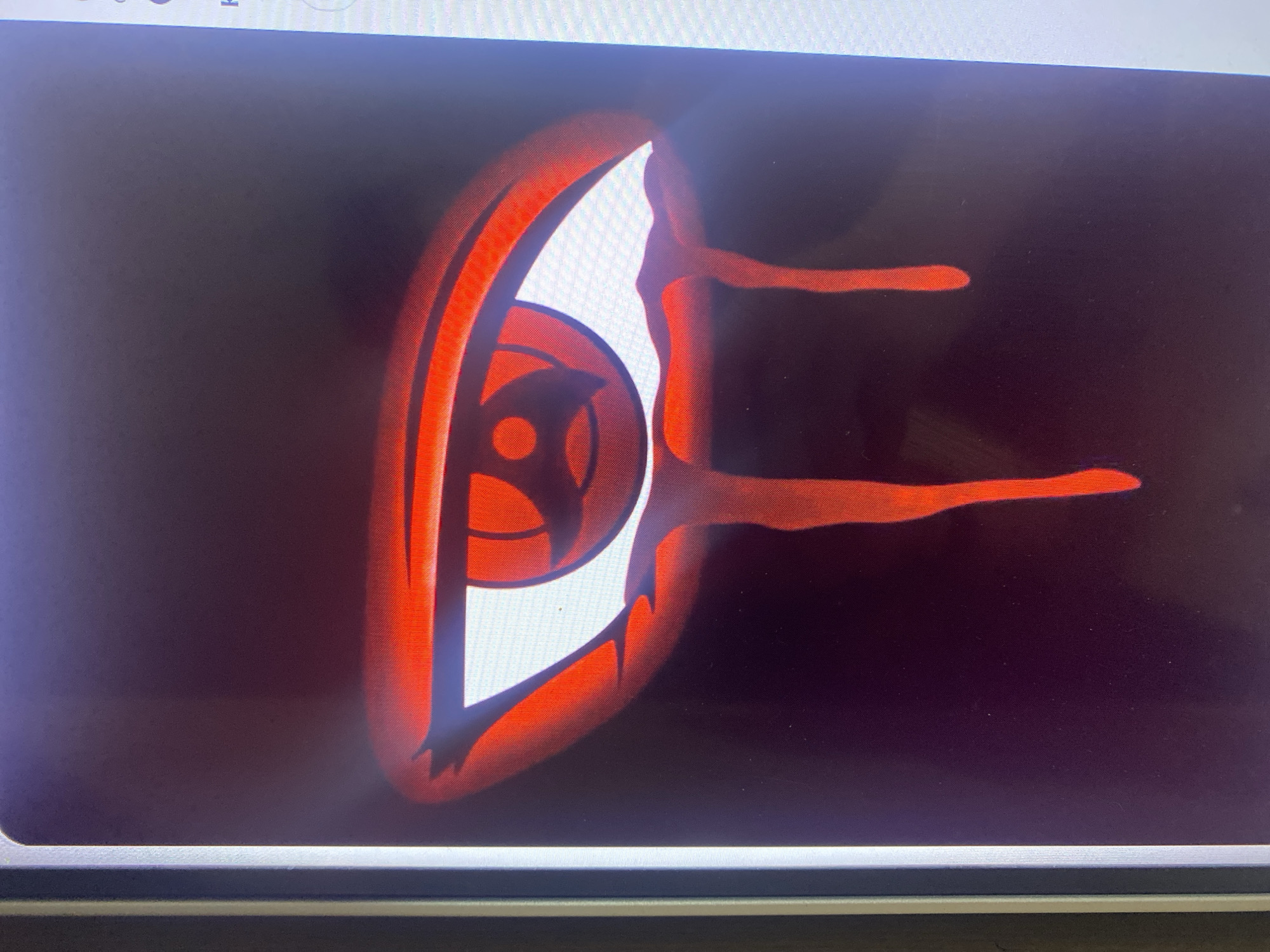 The image displays a close-up of a digital illustration of a stylized red eye with a black background. The eye features concentric red rings within a white iris and appears to be "crying" red liquid that drips down from below the eye. The image is a photograph of a screen displaying this illustration. The location in Samara, Russia is not determinable from the provided image.