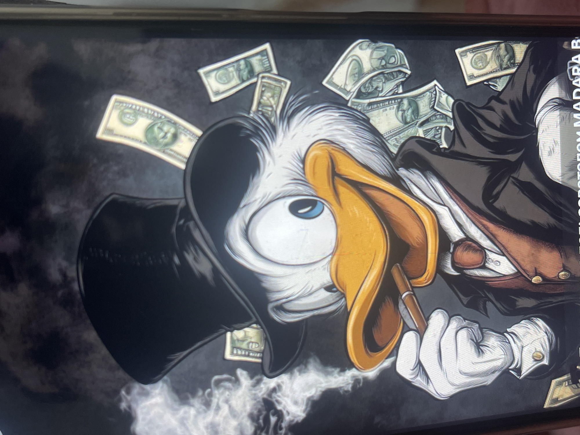 The image is a close-up, portrait-style illustration of Scrooge McDuck, the cartoon character. He is depicted wearing a black top hat, a white shirt, a reddish-brown vest, and a dark suit jacket. He has white gloves on and is holding a lit cigar in his right hand, with smoke emanating from it. Several dollar bills are scattered around his head and body, some tucked into his hat. His eyes are wide open and blue, and his beak is a bright yellow-orange. The background is dark and appears to be a textured wall or fabric. The image is a digital rendering, likely a wallpaper or poster. There is no indication of a specific location in Bishkek City, Kyrgyzstan, as this is a fictional character and a stylized artwork.