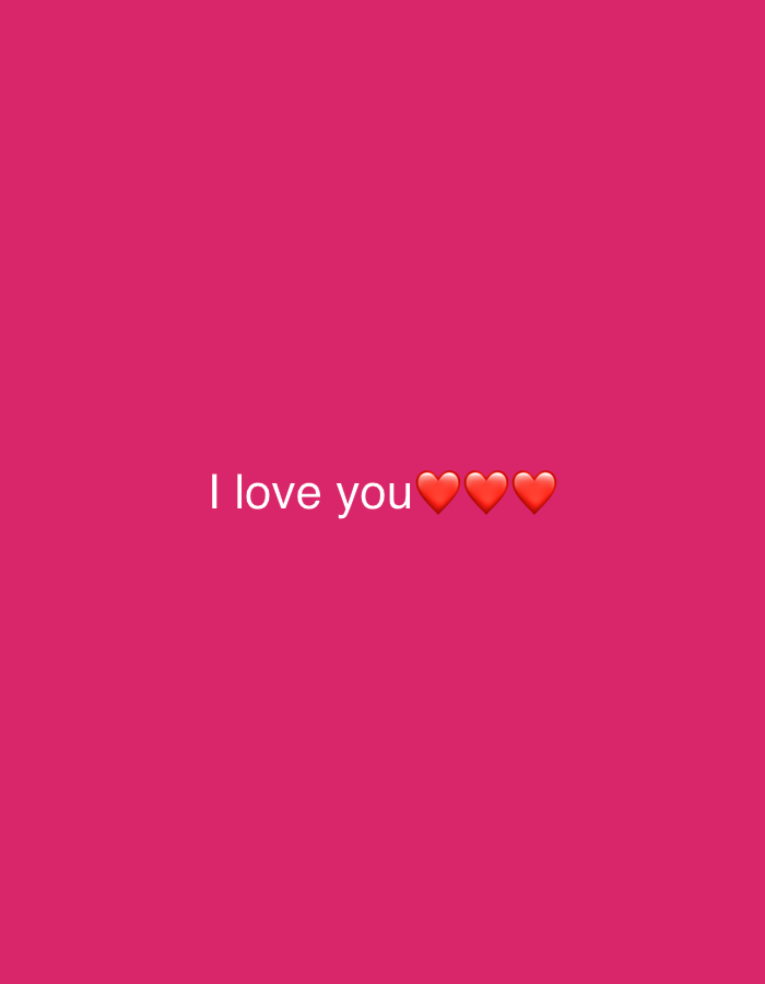 The image displays a uniform, solid pink background. Centered horizontally and slightly above the vertical midpoint, the phrase "I love you" is rendered in white, sans-serif typeface. Immediately following the text are three standard red heart emojis, arranged in a horizontal sequence. There are no other discernible subjects, objects, people, or environmental details present. The scene does not provide any visual information to determine a specific geographical location, including Budva, Montenegro.