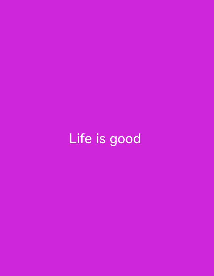 The image is a plain, solid magenta background with the text "Life is good" written in white, centered horizontally and towards the top of the frame. There are no people, objects, or environmental details present. The location in Nsugpe, Nigeria is not discernible from the image.