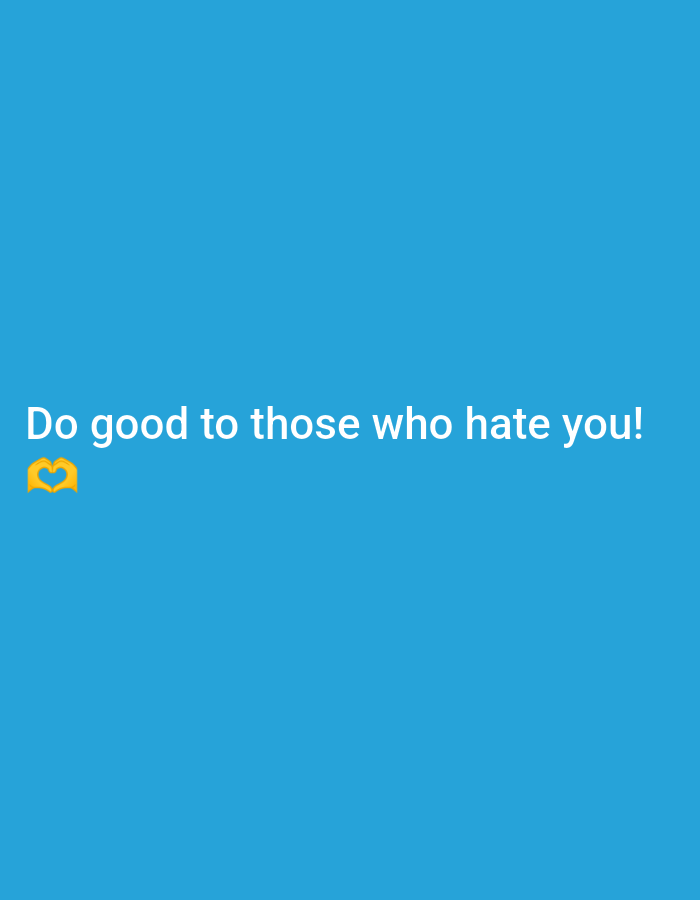 The image is a close-up, vertical shot of a light blue background with white text that reads "Do good to those who hate you!". To the left of the text, there is a yellow emoji of two hands forming a heart shape. The image is not a scene from San Isidro, Philippines; it is a graphic with text and an emoji on a plain background.