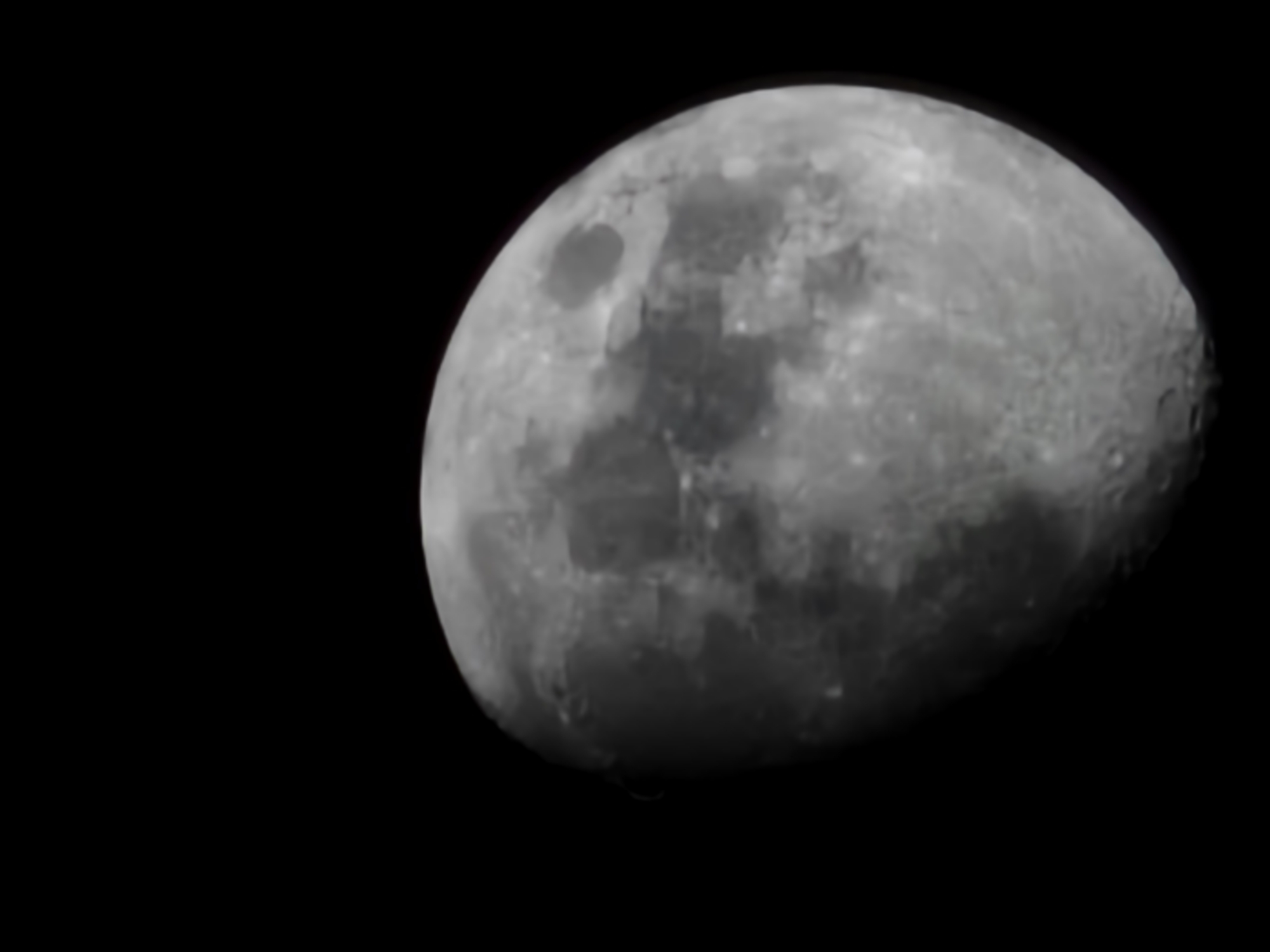The image shows a waxing gibbous moon against a black background. The moon's surface details, including craters and maria, are visible in varying shades of gray. There are no indications of Esch-sur-Alzette, Luxembourg, people, or objects in the image. The only subject is the moon.