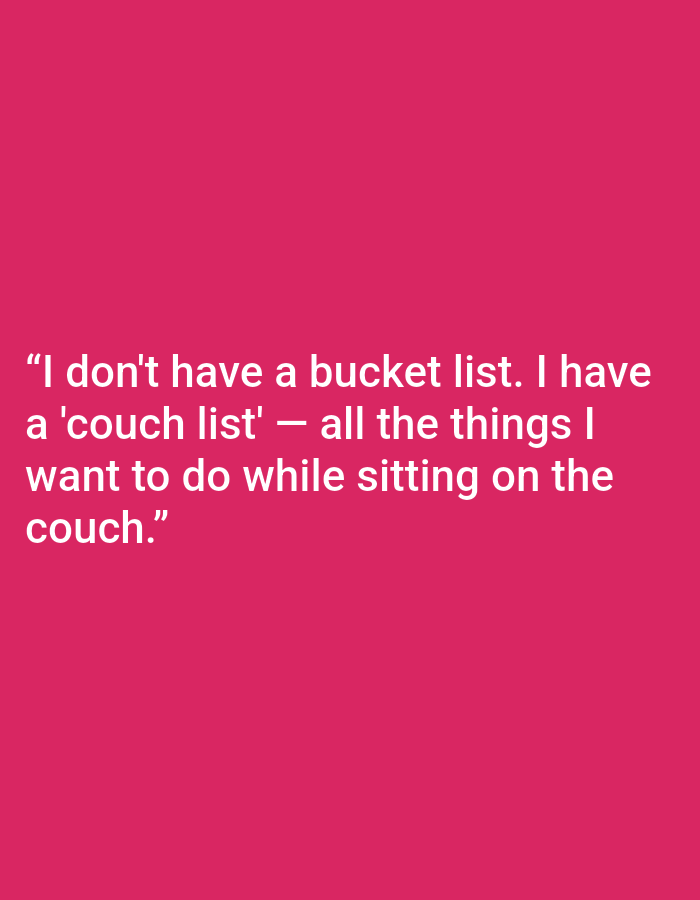 The image is a photograph of white text on a bright pink background. The text reads: "I don't have a bucket list. I have a 'couch list' — all the things I want to do while sitting on the couch." There are no people, objects, or environmental elements visible in the image, nor is there any indication of a location in Kępno, Poland.