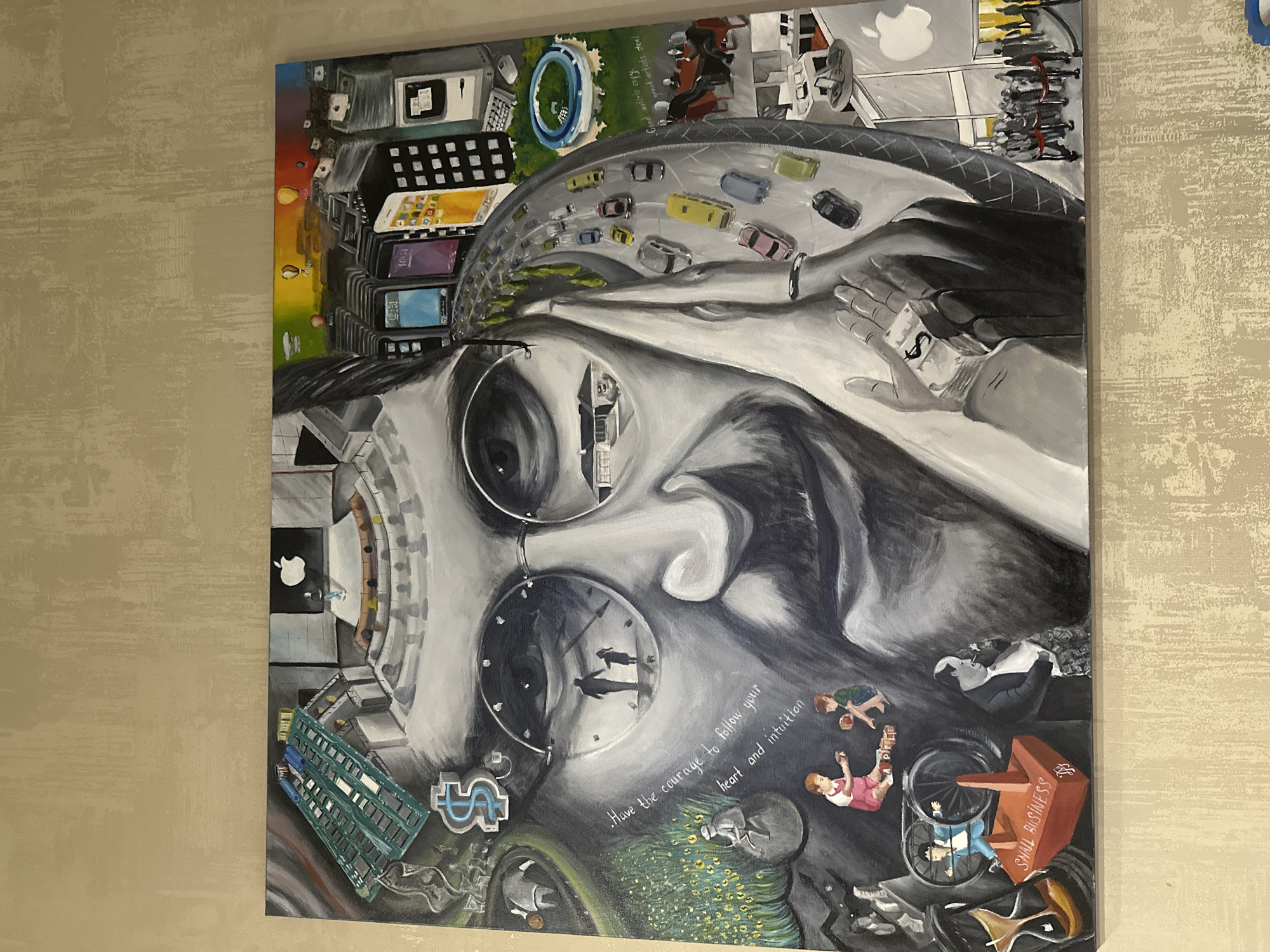This is an oil painting on a canvas, depicting a portrait of Steve Jobs surrounded by various symbolic elements related to his life and career. The portrait itself is rendered in grayscale, with subtle shading and highlights.
Within the portrait's reflections and surrounding elements, several scenes are illustrated. On the left, a motherboard with colorful circuits and a large dollar sign suggest technology and finance. Below this, a child sits on a rock in a field of sunflowers, with a bicycle and a wheelchair nearby, hinting at childhood and accessibility. Further down, two children play with alphabet blocks. To the right of the portrait, a highway with cars spirals upwards, bordered by buildings representing a city. These buildings display images of iPhones and other Apple products, as well as an Apple logo. An aerial view of the Apple Park campus is also visible. A depiction of the Apple Store entrance, with people queuing, is shown at the bottom right. Another scene shows a group of suited figures in a meeting, possibly symbolizing business. The right hand of Steve Jobs is prominent, holding a stack of money with a dollar sign.
The painting is displayed against a textured wall, with a neutral, light brown hue. The lighting is ambient, casting subtle shadows from the painting onto the wall. The location is not specified in the image, so it is Unknown, Unknown.