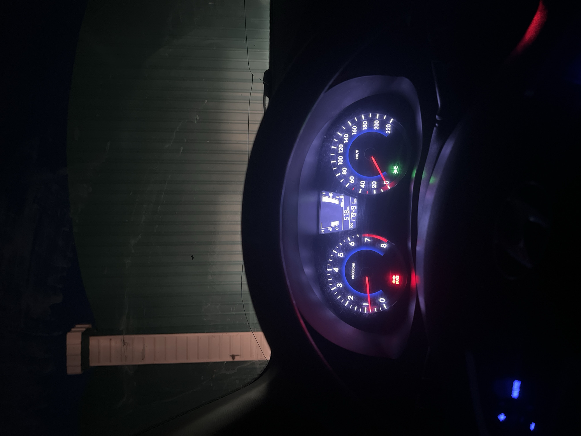The image depicts the illuminated dashboard of a car at night. The speedometer shows a speed of approximately 20 km/h. The tachometer indicates approximately 1,500 rpm. The odometer displays 17,949 km. The location is not specified by the data and it is not apparent in the image.