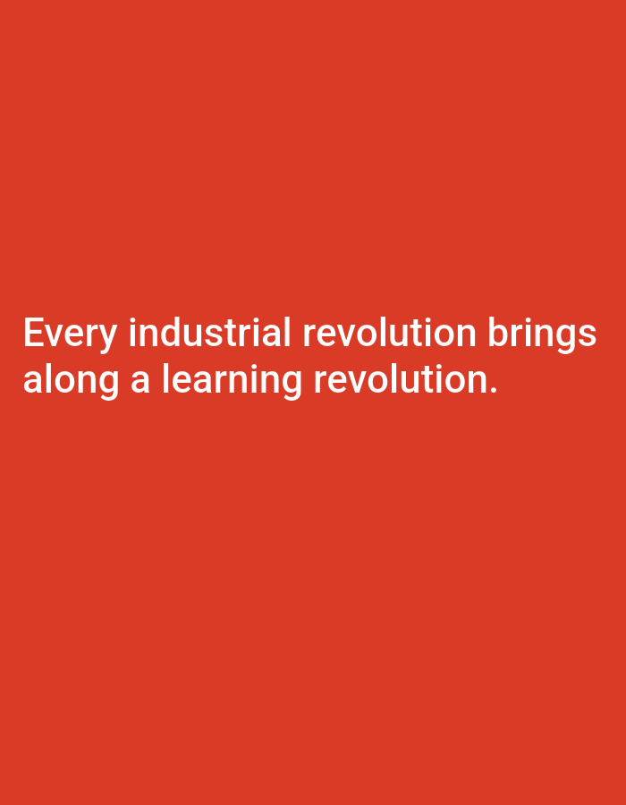 The image is a photograph of a red background with white text. The text reads: "Every industrial revolution brings along a learning revolution." There are no people, objects, or any discernible environmental details to describe. The location in Bukuru, Nigeria, is not depicted in the image.