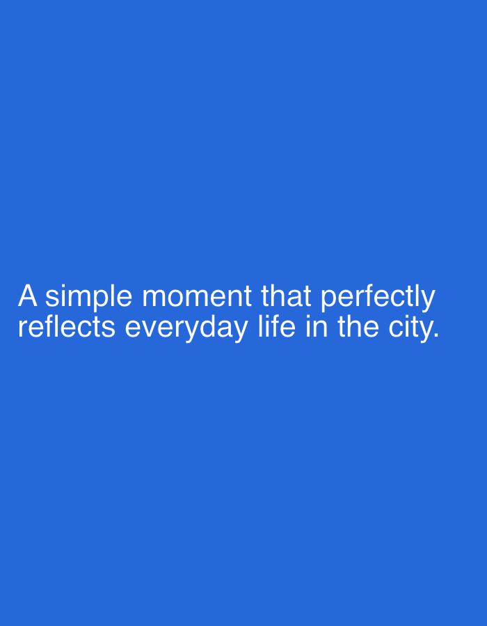 The image contains white text on a blue background. The text reads: "A simple moment that perfectly reflects everyday life in the city." There is no discernible location in the city of Kaolinovo, Bulgaria.