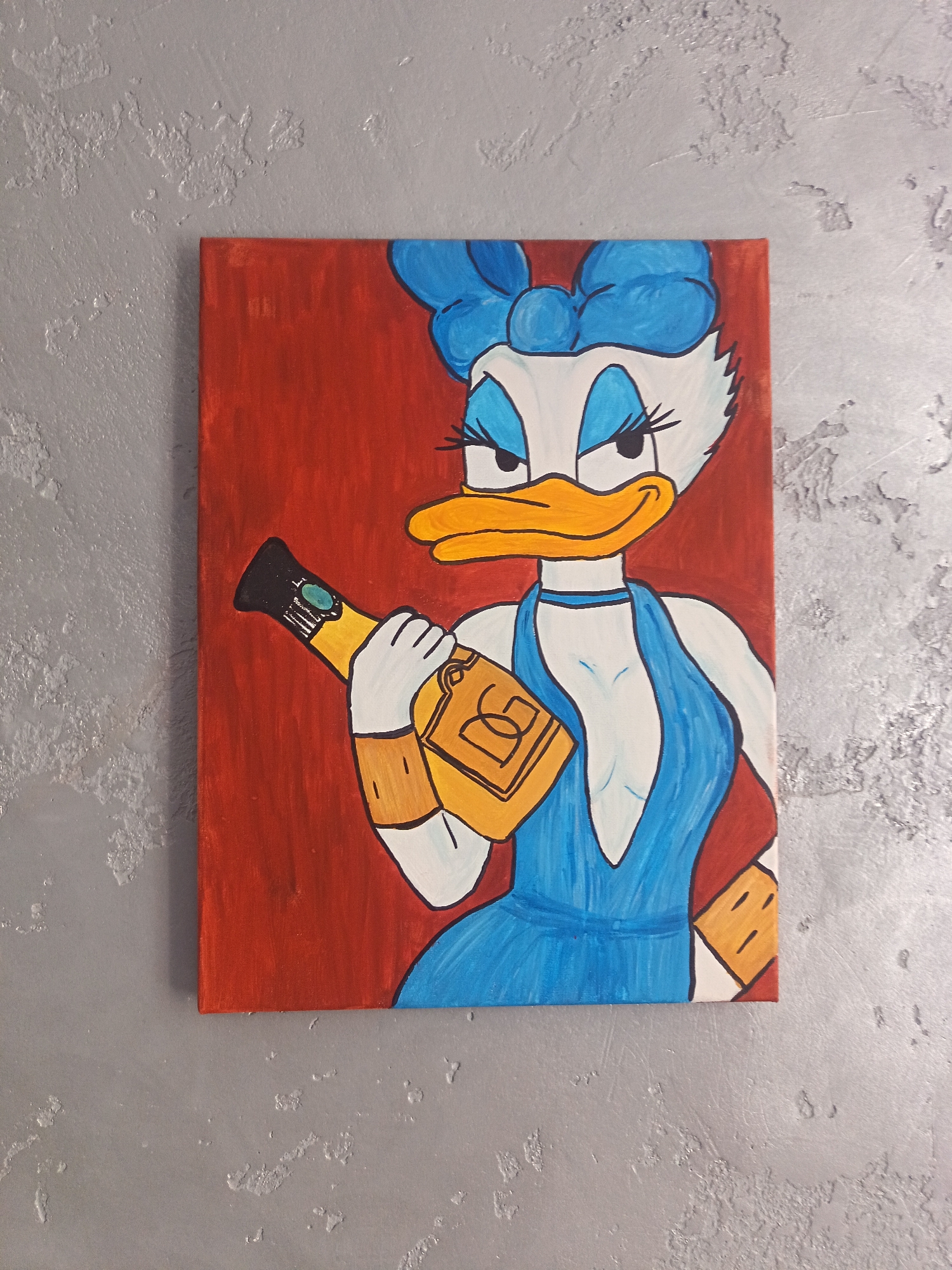 A painting of Daisy Duck in a blue dress and blue bow is displayed on a textured grey wall. Daisy Duck is holding a champagne bottle in her right hand. The background of the painting is red. The painting is hanging on a wall that has a rough, textured finish and appears to be a neutral gray color. There are some lighter, almost white, splotches and raised textures on the wall, giving it a somewhat worn or aged appearance. The painting is rectangular and oriented vertically.