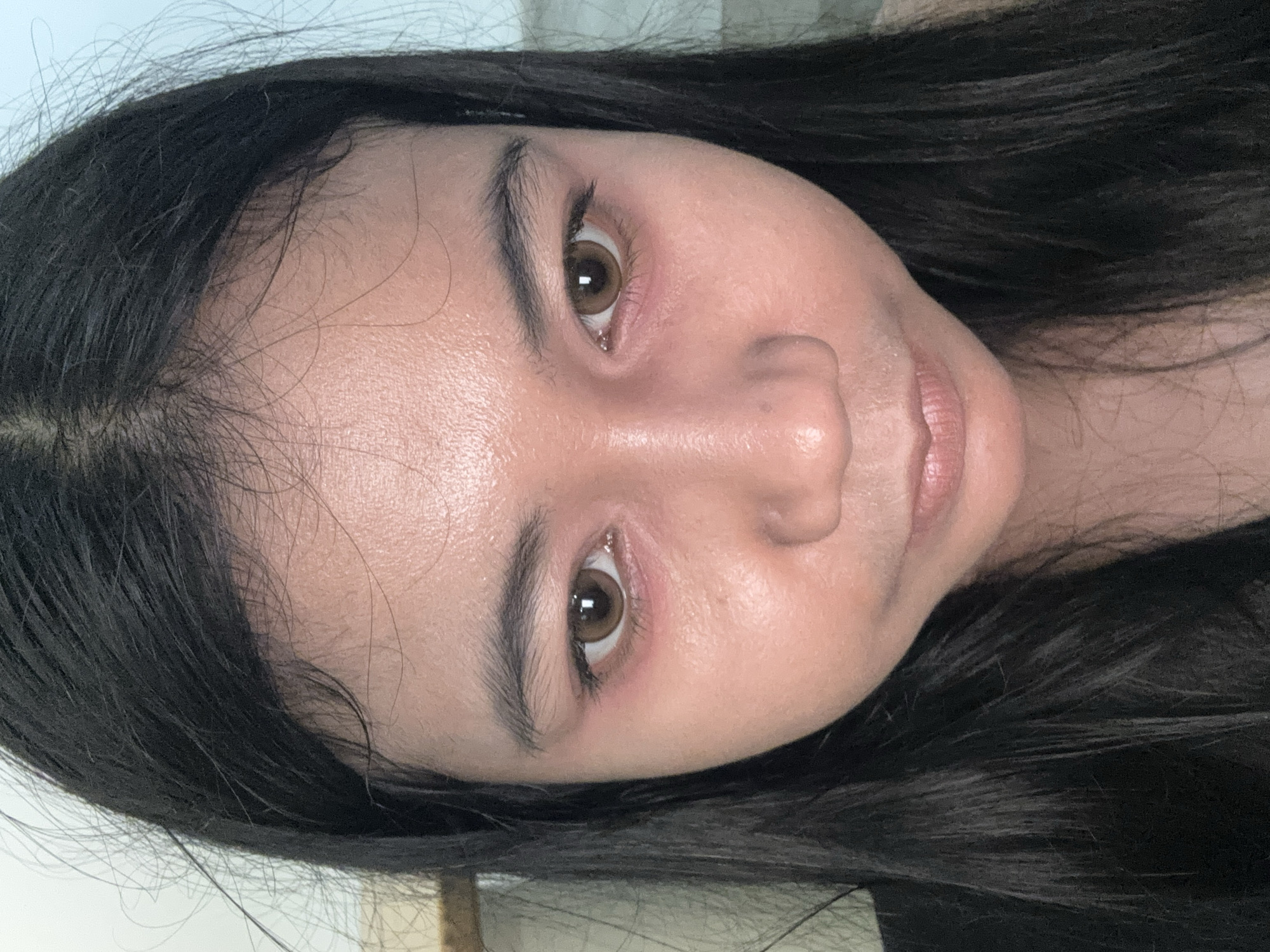 A close-up photograph shows a person with dark hair, brown eyes, and light skin. The person's face is the primary focus, angled slightly, revealing details of their facial features such as the shape of their nose, eyebrows, and lips. The background is blurred and indistinct. There is no clear indication of location or activity in the scene to suggest the city of North Jakarta, Indonesia.