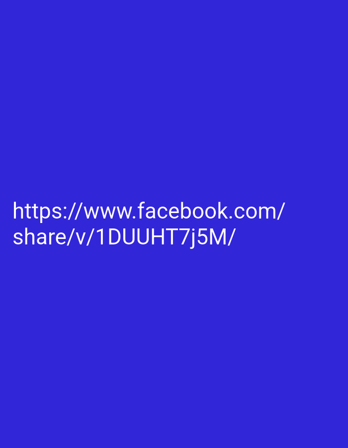 The image displays a blue background with white text. The text reads:
"https://www.facebook.com/
share/v/1DUUHT7j5M/"
This is a URL, likely a link to a Facebook video or post. The image does not contain any information about a specific location in Lakea Satu, Indonesia, nor does it depict any people, subjects, objects, actions, interactions, or environmental details.