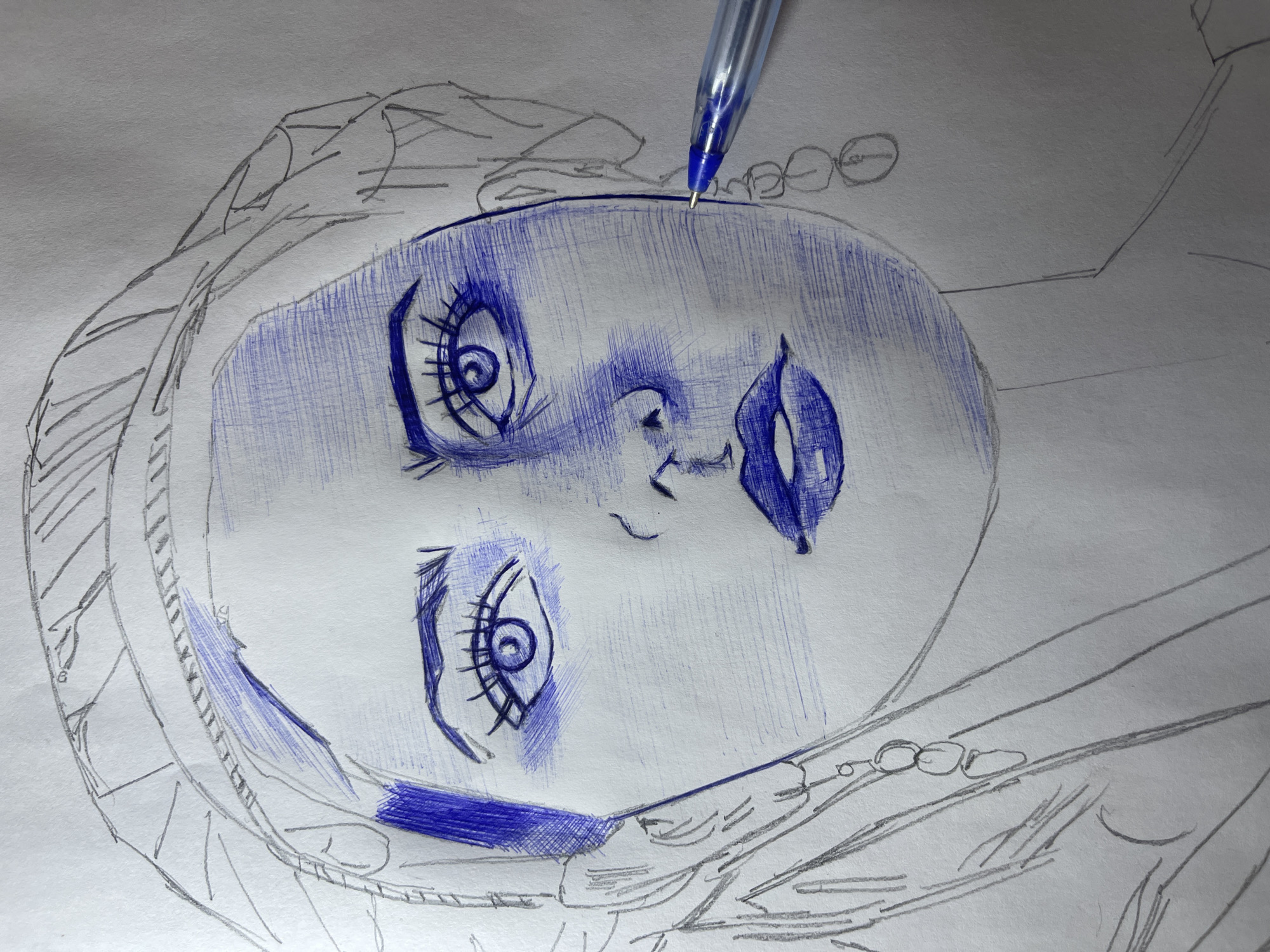 A partially completed drawing of a person's face is on white paper. The face is oriented with the right side of the head at the top of the image. The face is largely filled in with blue ballpoint pen, while the surrounding clothing and hair are outlined in pencil. A blue ballpoint pen is poised above the face, as if in the process of adding more detail. The background is a plain white surface. The location Jos, Nigeria is not determinable.