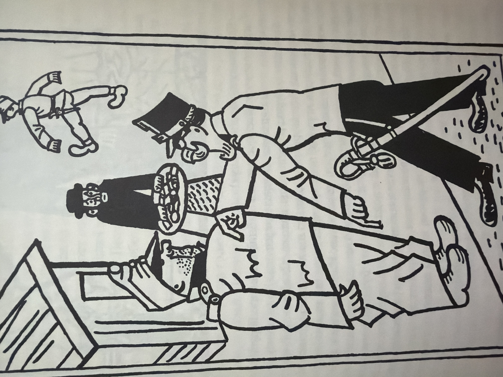 The image depicts a stylized, black and white illustration of a scene that appears to be outside a building. In the foreground, two figures in uniforms are interacting. One figure, wearing a hat and possibly a military uniform with epaulets and a peaked cap, is holding a tray with food and gesturing towards the other figure with a pointing finger. The second figure, also in uniform with a cap and what appears to be a sword at their side, is reaching out their hand. Behind these two, a third figure in a hat and coat stands near the building entrance. In the upper right corner, another figure in uniform is shown in mid-stride, with one leg raised. The building appears to be a simple structure with a sloped roof and an entrance. The ground is rendered with small dots. The illustration has a cartoonish or folk art style. There is no discernible information within the image that would indicate its location in the city of Pazardzhik, Bulgaria.