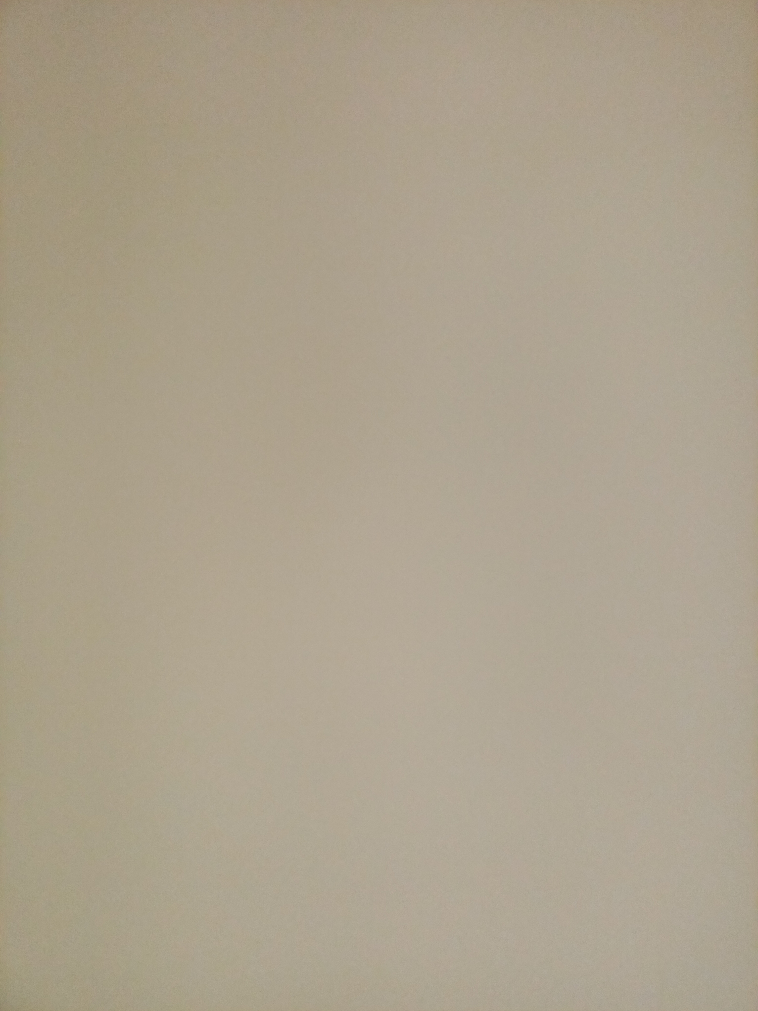 The image is a close-up, abstract shot of a uniformly textured, light beige surface. There are no discernible objects, people, or actions present. The lighting is even, with no harsh shadows, suggesting it was taken indoors or in an overcast environment. The texture appears to be slightly grainy, possibly indicating a wall, fabric, or paper. The image provides no geographical or contextual information, and therefore cannot be definitively linked to Rostov-on-Don, Russia, or any other specific location.