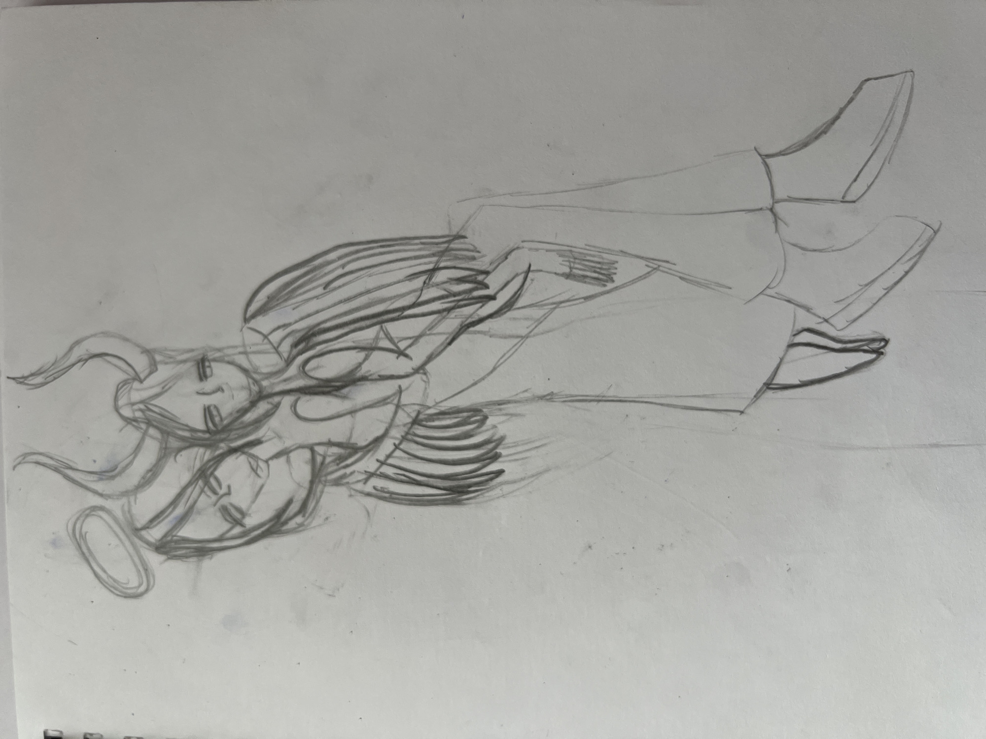 This is a black and white sketch on paper depicting two figures with angelic features, possibly representing angels. One figure is positioned above the other, and they appear to be embracing or in close proximity. Both figures have delicate facial features, long flowing hair, and wings. The upper figure has what looks like horns protruding from its head, and a halo encircles the head of the lower figure. They are both depicted with their eyes closed, suggesting a state of peace or serenity. The figures are wearing flowing garments. Their legs are bent, and their feet are pointed upwards and outwards. The sketch is rendered with loose, expressive lines, giving it a sense of movement and ethereal quality. The background is plain, with no specific setting or environmental details indicated, focusing the attention entirely on the figures. There is no visible text in the image. The overall impression is one of tenderness and spiritual connection.