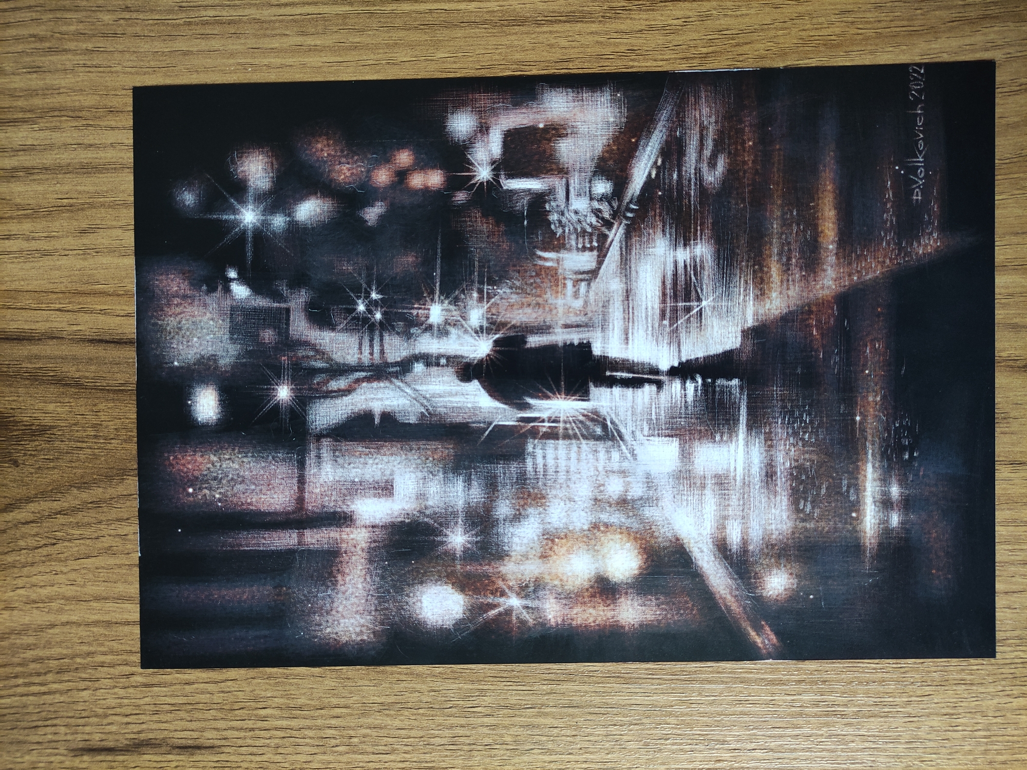 An impressionistic watercolor painting depicts a night scene in Tbilisi, Georgia. The subject is a figure standing on a bridge or elevated walkway. The environment includes city lights and their reflections on a wet surface, likely from rain. The dominant colors are dark blues, browns, and whites, creating a moody, urban atmosphere. The artist's signature, "D. Volkovich, 2022," is visible in the upper right corner.