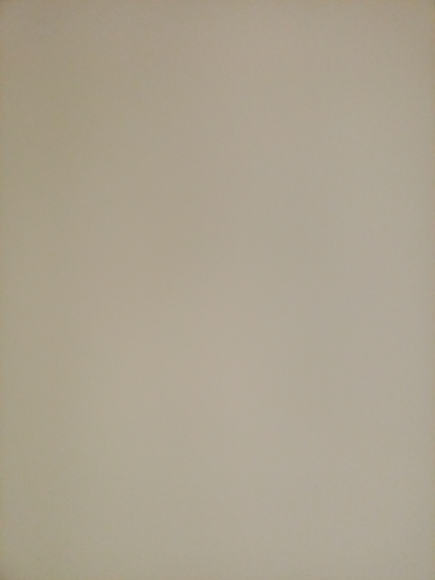 The image is a plain, textured surface, likely a wall, with a uniform light beige color. There are no discernable objects, people, or features within the frame. The lighting appears to be soft and diffused, with no harsh shadows. The texture of the surface suggests it could be painted plaster or a similar material. There is no indication of any location in Rostov-on-Don, Russia, or any other geographical information.