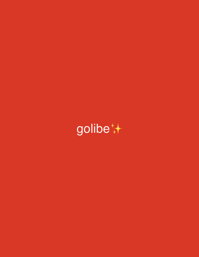 The image is a close-up, evenly lit shot of a solid, vibrant red background. Centered in the frame, near the bottom, is the word "golibe" written in white text. To the right of "golibe" are two small, stylized yellow stars. There are no people, objects, or environmental features depicted in the image beyond the text and decorative elements. The location in Ado, Nigeria, is not ascertainable from the visual information provided.