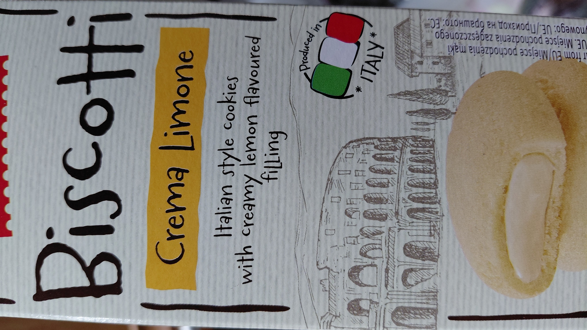 The image shows the packaging of "Biscotti Crema Limone", Italian style cookies with creamy lemon flavored filling, produced in Italy. The packaging features an image of the Colosseum in Rome.