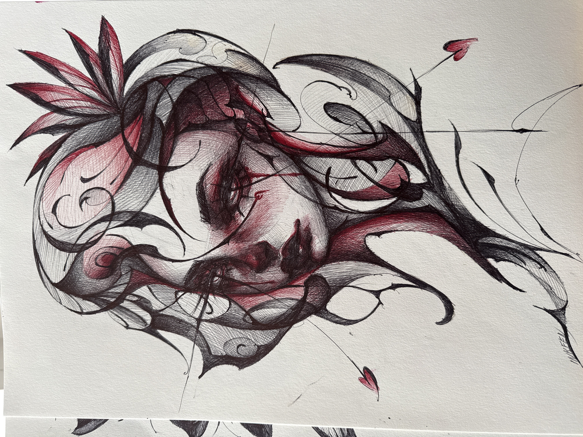 The image is a stylized ink drawing in shades of black, red, and gray on white paper. It depicts a face with stylized hair and surrounding tendrils. The face is positioned centrally, looking downwards. A flower-like element is located at the top left. Small, heart-shaped objects are attached to the tendrils extending from the main figure. The style is abstract and somewhat gothic. The setting is undetermined. There is no indication the drawing is related to the city of Sofia, Bulgaria.