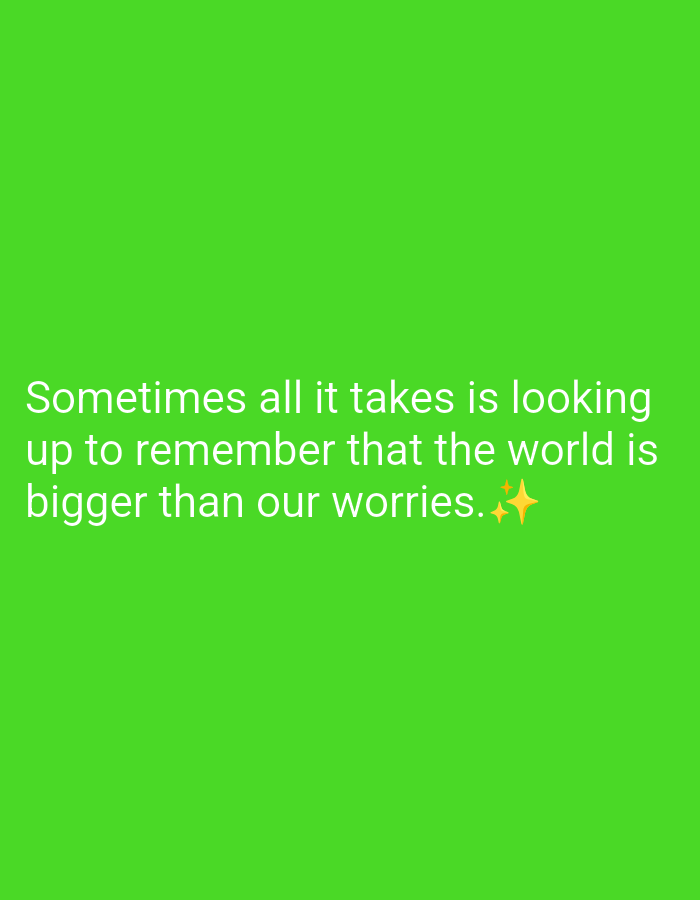 The image is a bright green background with white text. The text reads: "Sometimes all it takes is looking up to remember that the world is bigger than our worries." There are two small yellow stars at the end of the text. There is no discernible location in Batumi, Georgia, or any other city.