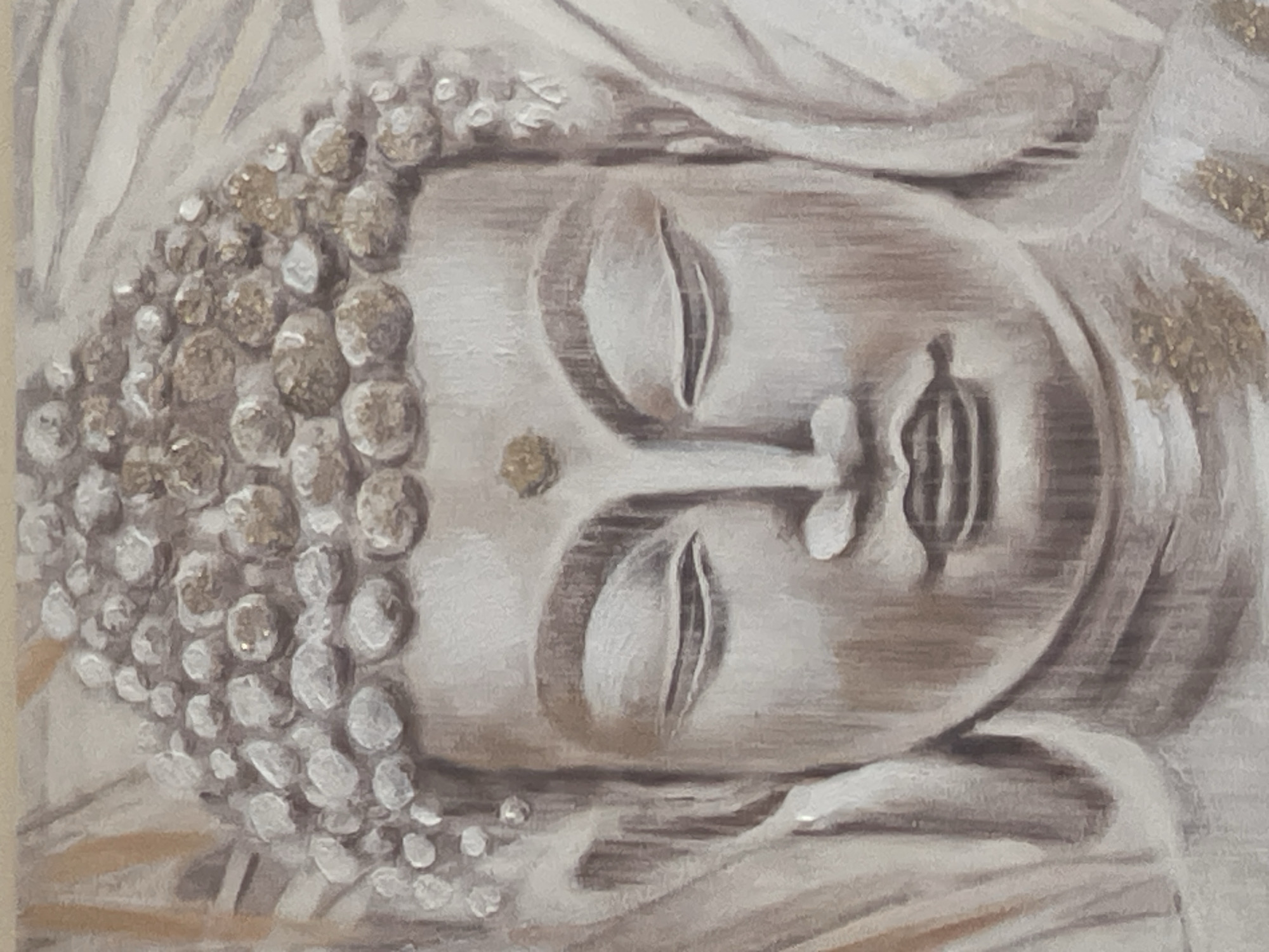 The image is a close-up, vertical, oil painting of a Buddha's head. The painting uses muted tones of white, grey, and gold. The Buddha has closed eyes, a serene expression, and a headdress composed of many rounded, pearl-like elements, some of which have gold flecks. A prominent gold dot is visible on the Buddha's forehead. The background is abstract and consists of flowing, light-colored fabric or drapery, with some vertical lines suggestive of rays or folds. There are no people, actions, or interactions depicted. The image is not related to the city of Minsk, Belarus.