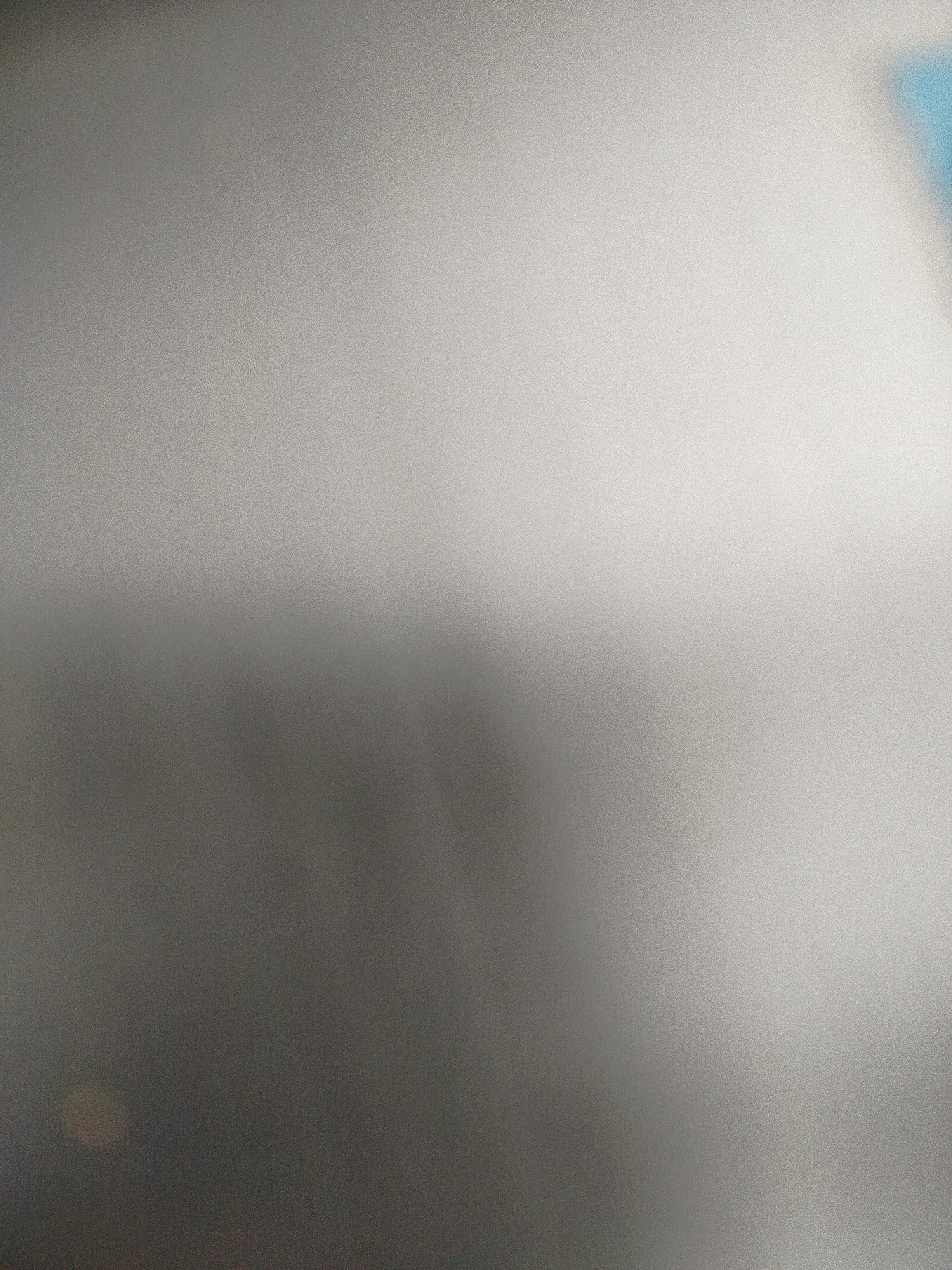 The image shows a blurred, gradient-like pattern transitioning from dark gray to light gray. The upper right corner exhibits a hint of light blue. It is not possible to determine the location in the city of Yerevan, Armenia or any people, subjects, objects, actions, interactions, or the environment with the information in the photo.