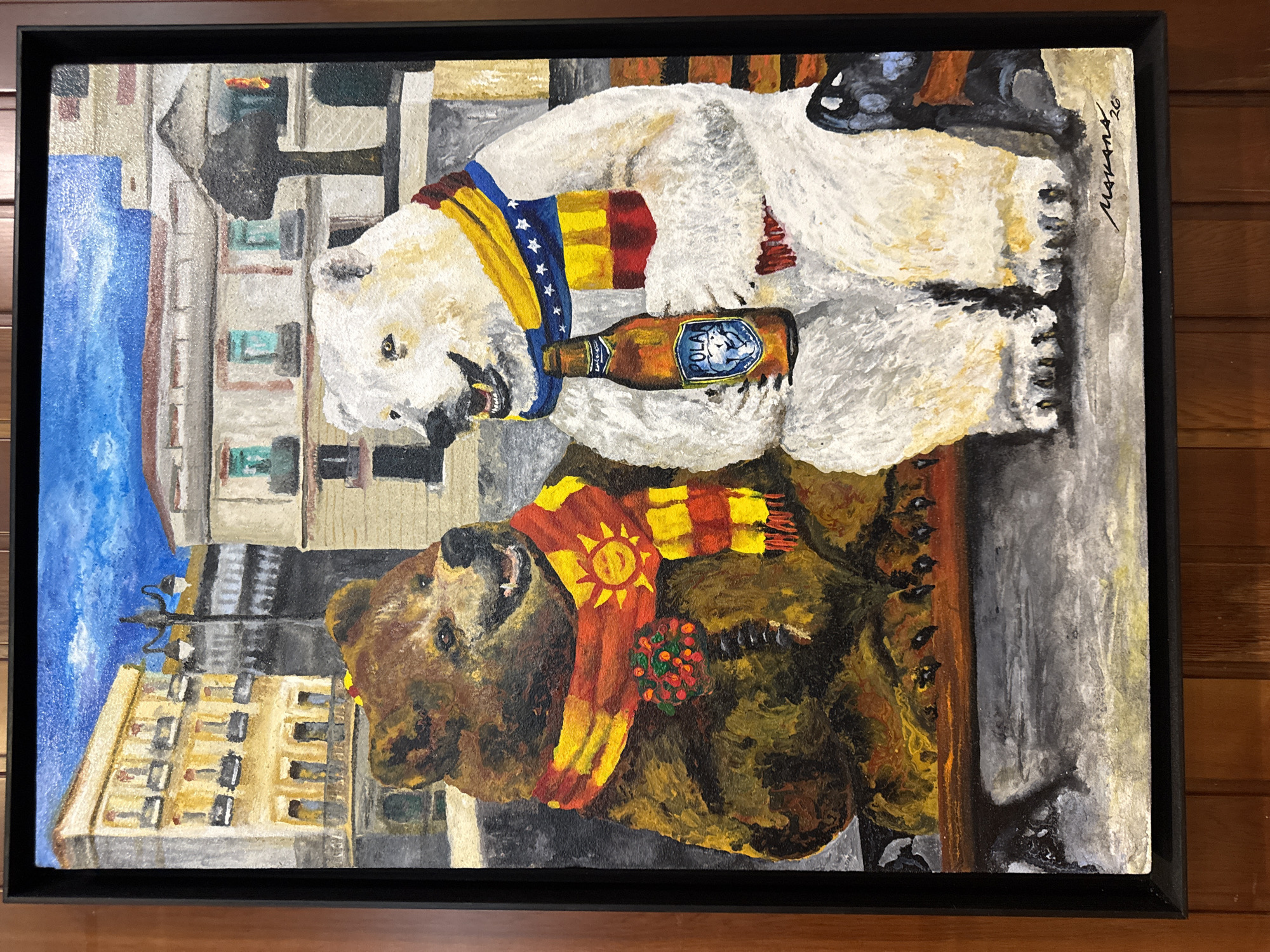 The image is a painting depicting two anthropomorphic bears sitting on a park bench in a city. The bear on the left is a brown bear wearing a scarf with a sun and flowers. The bear on the right is a polar bear wearing a scarf and holding a bottle of "POLAR" beer. In the background, there are buildings and a blue sky with clouds. The painting is signed "MAVANS, '20" in the lower right corner. There is no information in the image that suggests it is located in Torrejón de Ardoz, Spain.