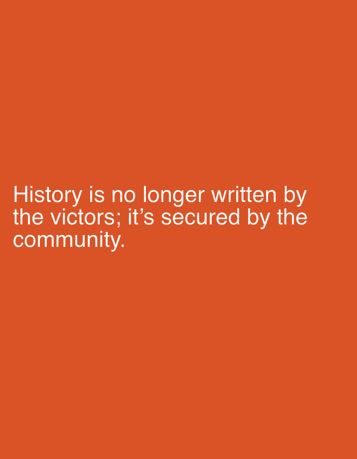 The image displays white text on an orange background. The text reads: "History is no longer written by the victors; it's secured by the community." There are no people, objects, actions, interactions, or environmental details to describe as the image is a text-based graphic. The location of Shumen, Bulgaria, is not visible or relevant to the image content.