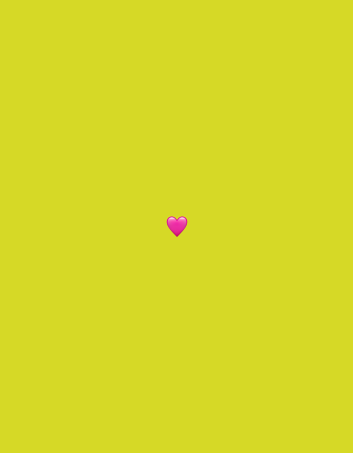 A pink heart emoji is centered against a solid yellow background.