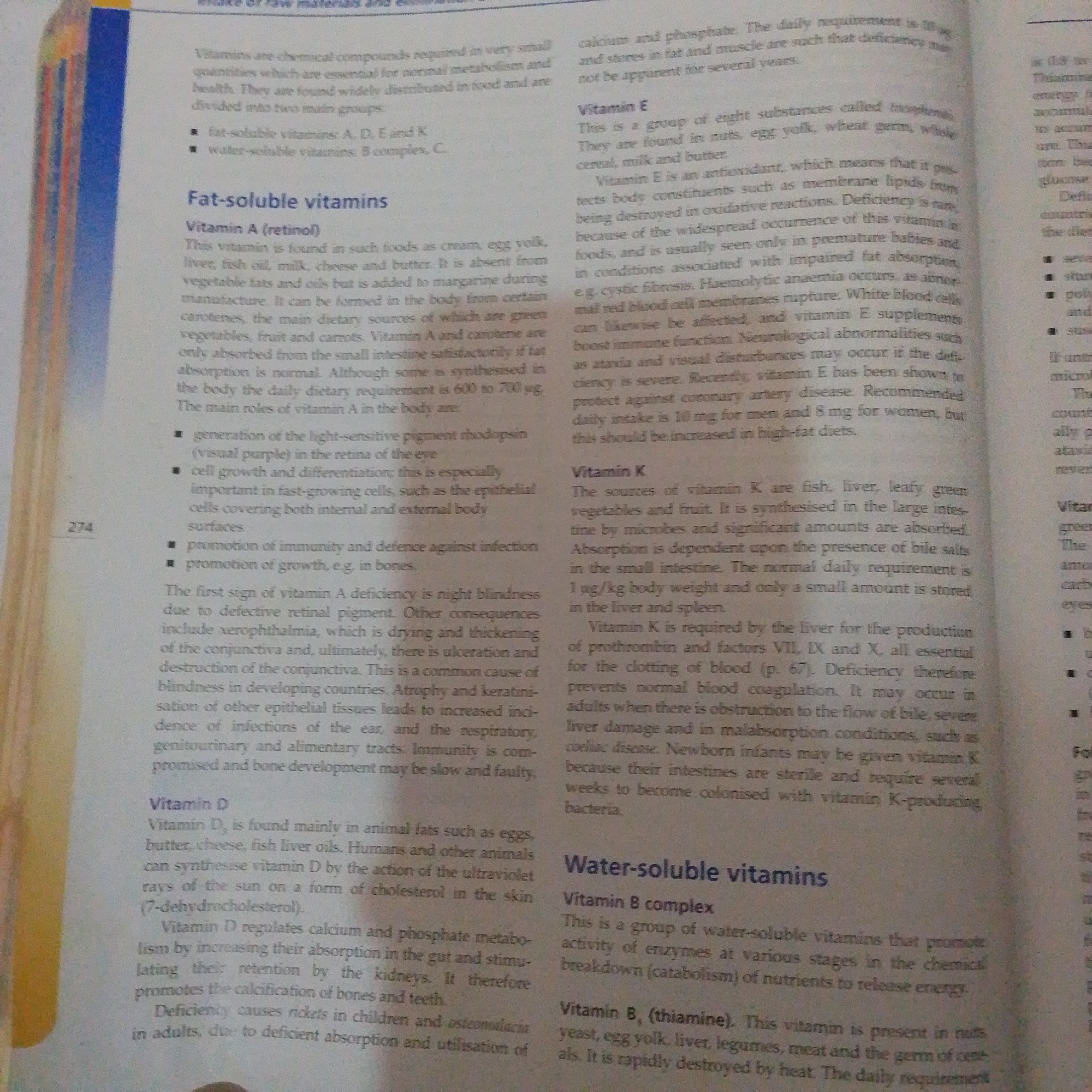 The image is a page from a book or document, likely a textbook, discussing vitamins. It is not an image of the city of Jalingo, Nigeria. The text is divided into sections on "Fat-soluble vitamins" (specifically Vitamin A and Vitamin E) and "Water-soluble vitamins" (specifically Vitamin B complex and Vitamin B, thiamine). It also includes a section on Vitamin D. The text explains the sources, functions, and deficiencies of these vitamins. There are no people or specific locations visible in the image; it is purely textual content.