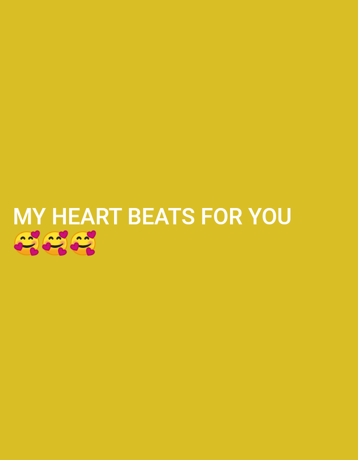A digital graphic features white text on a yellow background that reads "MY HEART BEATS FOR YOU." Below the text are three smiling emoji faces, each with pink hearts above their eyes. The image is a flat graphic with no discernible environmental context, and therefore cannot be associated with a specific location in Plemahan, Indonesia.