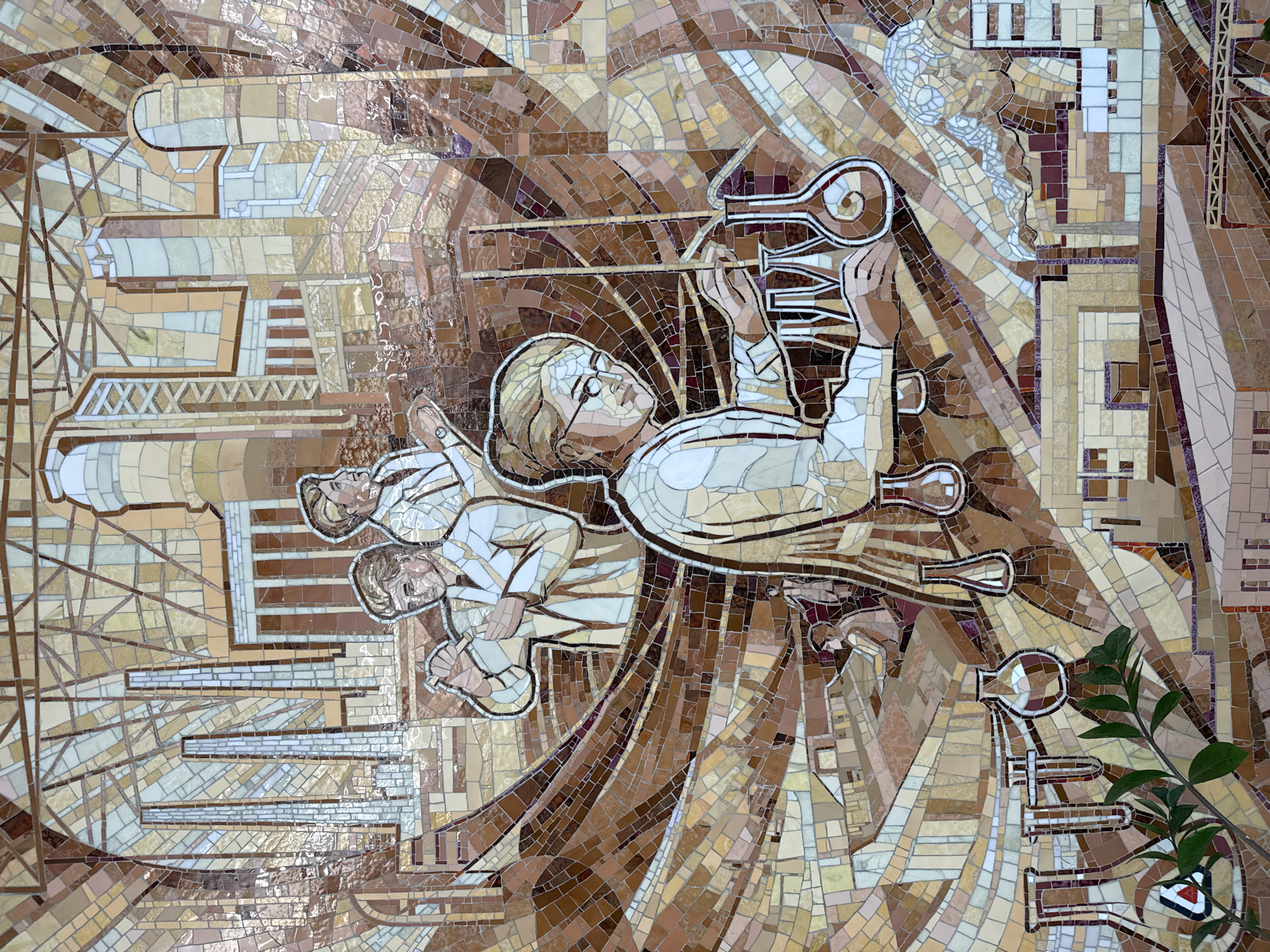 This mosaic depicts a scene of scientific endeavor and industrial progress. In the foreground, a female scientist wearing glasses and a lab coat is meticulously working with beakers and test tubes, suggesting laboratory research. Behind her, three male figures in similar attire are engaged in scientific activities. One figure is holding a beaker, another is looking upwards, and the third is also focused on his work. The background features stylized industrial elements, including smokestacks and factory buildings, representing the industrial landscape of Dzerzhinsk, Russia. The overall composition conveys a sense of innovation and the advancement of science and industry.