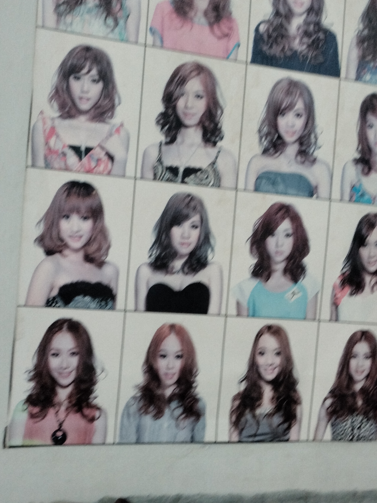 The image is a grid of passport-sized portraits of young Asian women. There are four rows and three columns of portraits, totaling twelve distinct images. Each woman is facing forward, with varying hairstyles and clothing. The background of each portrait is a plain, light color, possibly white or off-white. The overall aesthetic suggests a collection of promotional photos, perhaps for a band or modeling agency. The image does not contain any contextual information suggesting a location in the city of Langsa, Indonesia.