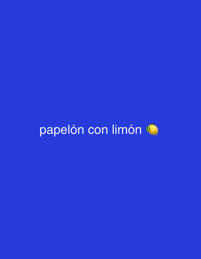 The image displays white text centrally placed on a solid, dark blue background. The text reads "papelón con limón" and is followed by a yellow lemon emoji. There are no people, objects other than the text and emoji, or specific scenes depicted in the image. No activity or event is taking place, as it is a static graphic. The color of the background is a uniform dark royal blue. The text font is simple and sans-serif. No time of day, weather, or specific location cues are visible within the image itself.