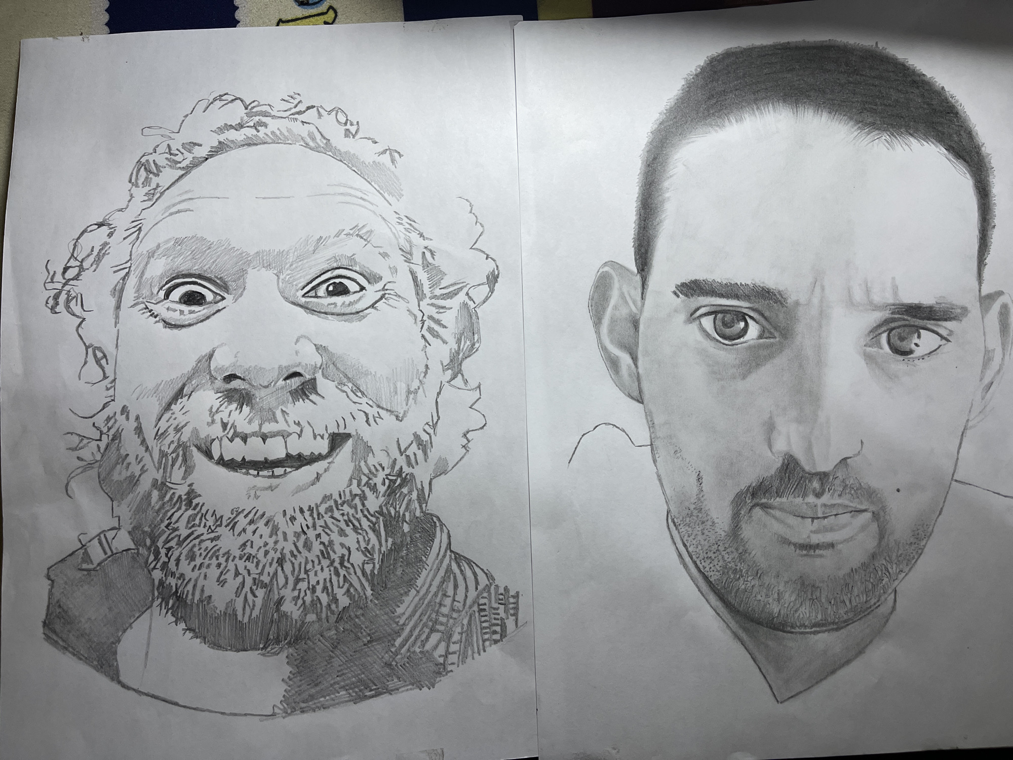 Two pencil portraits on white paper. The left portrait depicts a man with a wild, bushy beard, unruly hair, and exaggerated facial features, including a wide, toothy grin and bulging eyes. The right portrait depicts a man with a trimmed beard, neatly cropped hair, and a more serious expression. The background is plain white paper. No information is provided about the location in Jos, Nigeria.