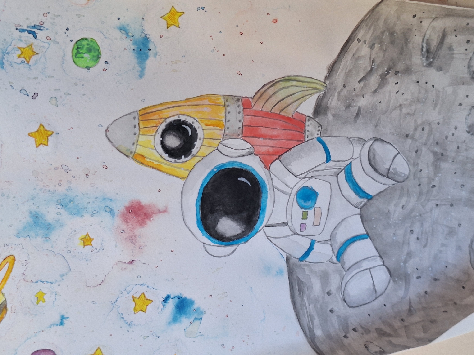The image is a watercolor painting depicting an astronaut sitting on a lunar surface next to a rocket. The astronaut is wearing a white spacesuit with blue accents and a black visor. The rocket is yellow and red with a silver tip. In the background, there are stars, planets, and colorful nebulae. The painting has a whimsical and childlike style. There is no indication of any specific location in Varna, Bulgaria.