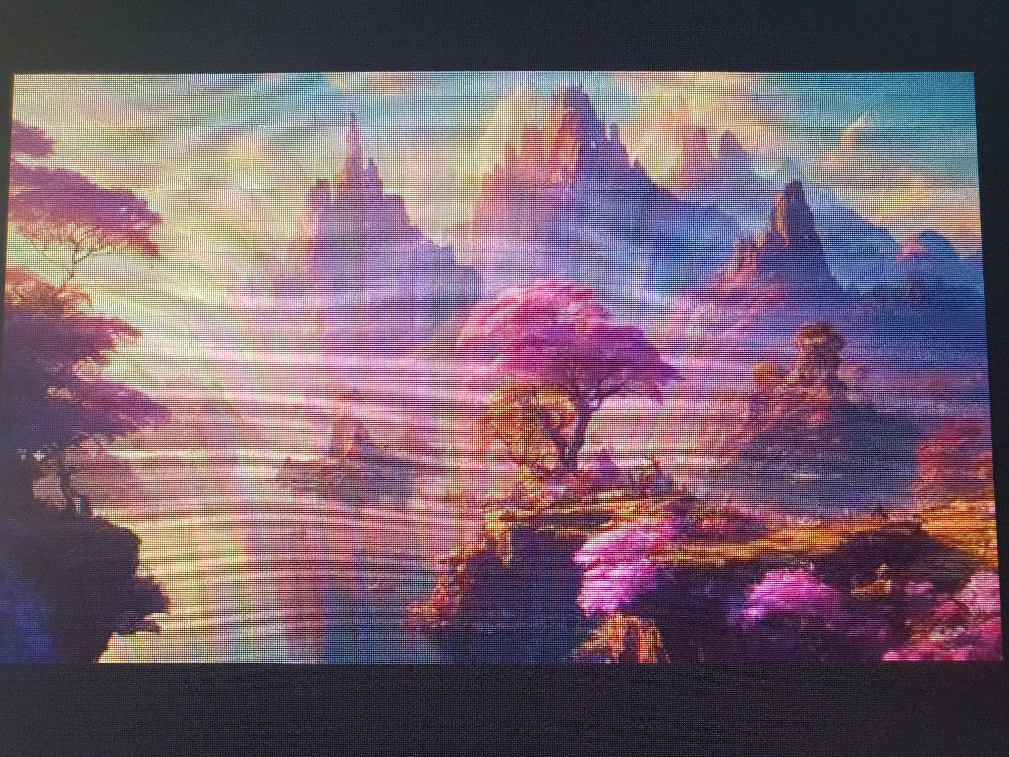 This is a high-angle, wide shot of a digital painting of a fantastical, alien landscape. The scene depicts a valley with a body of water in the foreground, surrounded by islands with vibrant, pink and purple foliage. Jagged, majestic mountains with pointed peaks rise in the background, bathed in the warm glow of a setting sun. The sky transitions from a soft yellow and orange near the horizon to a cool blue at the top. The image is presented on a screen, with visible horizontal lines characteristic of digital displays. The scene is devoid of any human presence or identifiable landmarks that would suggest a specific location in Tashkent, Uzbekistan, or any other real-world city.