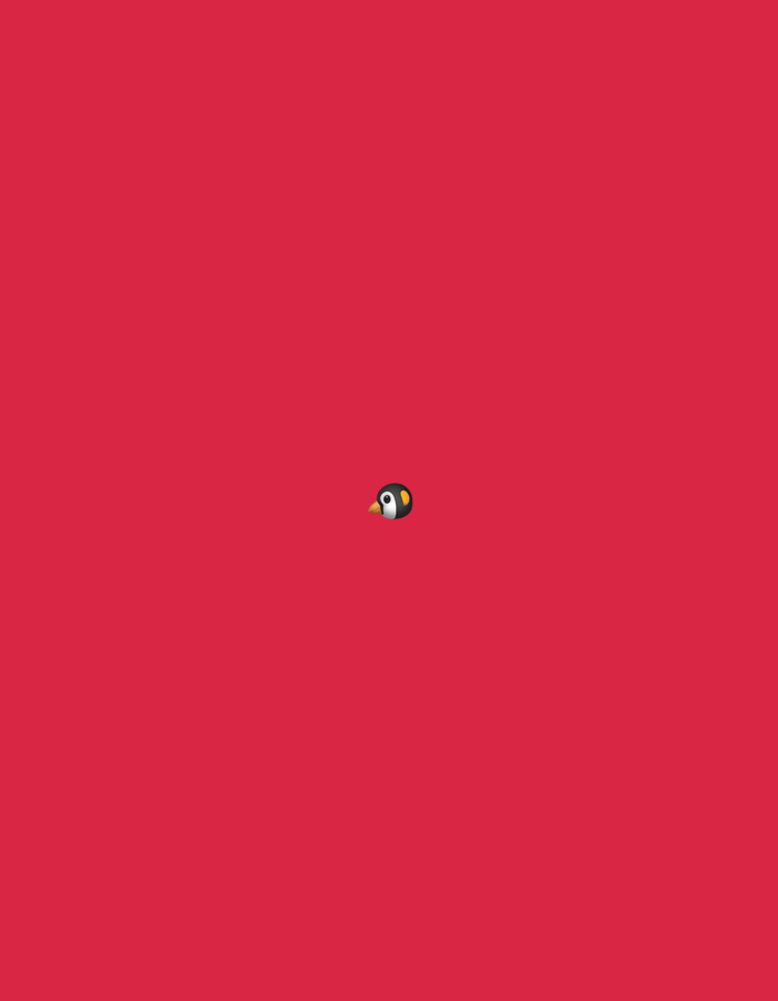 A small, cartoonish penguin emoji is centrally located on a plain, vibrant red background. The emoji is black and white with an orange beak and a white circle around its eye. There is no indication of a city, location, or specific environment.