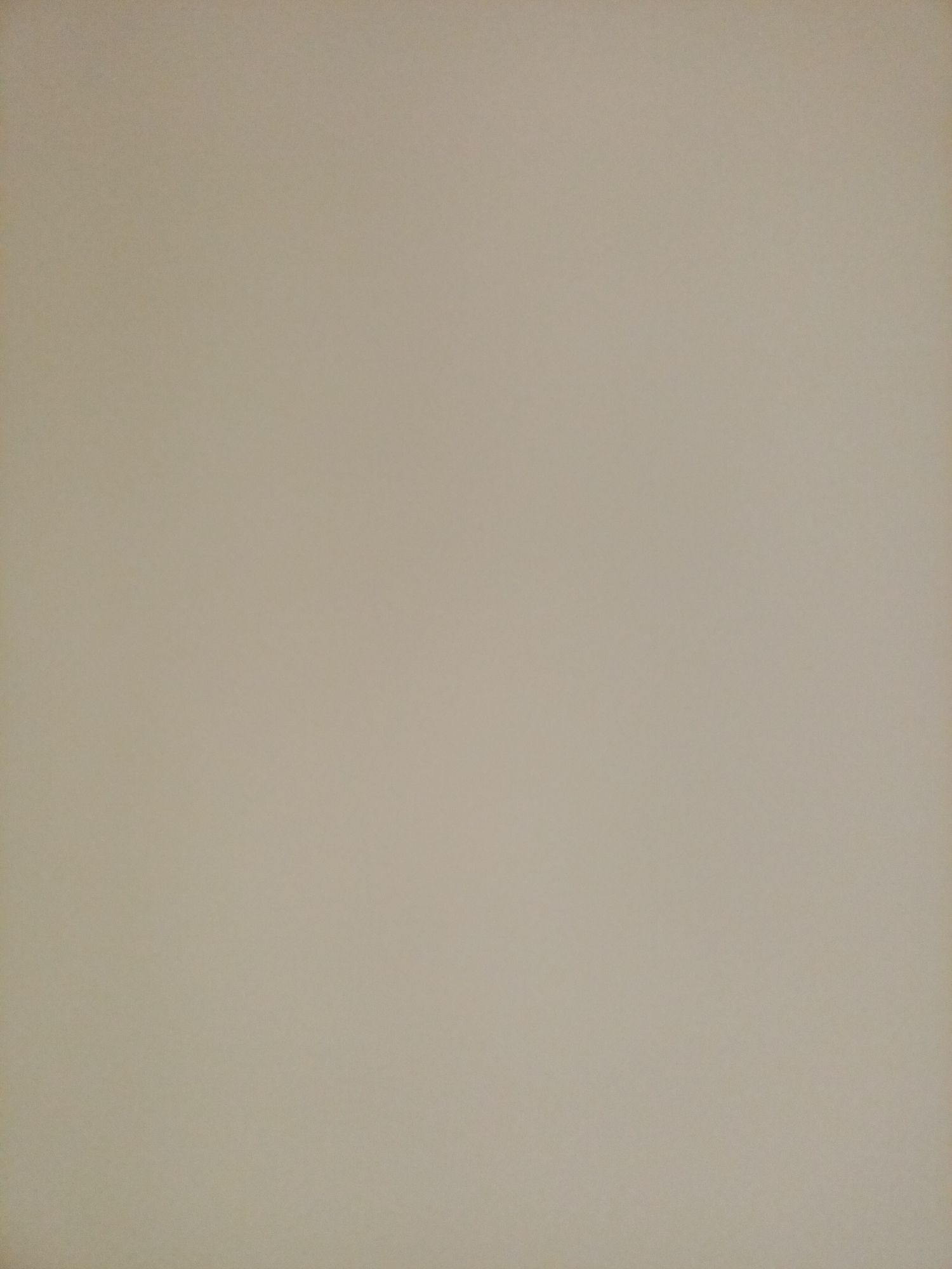 The image is a plain, unadorned wall with a beige or light brown hue. There are no visible objects, people, or distinguishing features within the frame. The lighting appears even, with no strong shadows or highlights. The texture of the wall is subtle and consistent across the entire surface. The image does not provide any information that would allow for its location to be identified within Rostov-on-Don, Russia, or any other city.