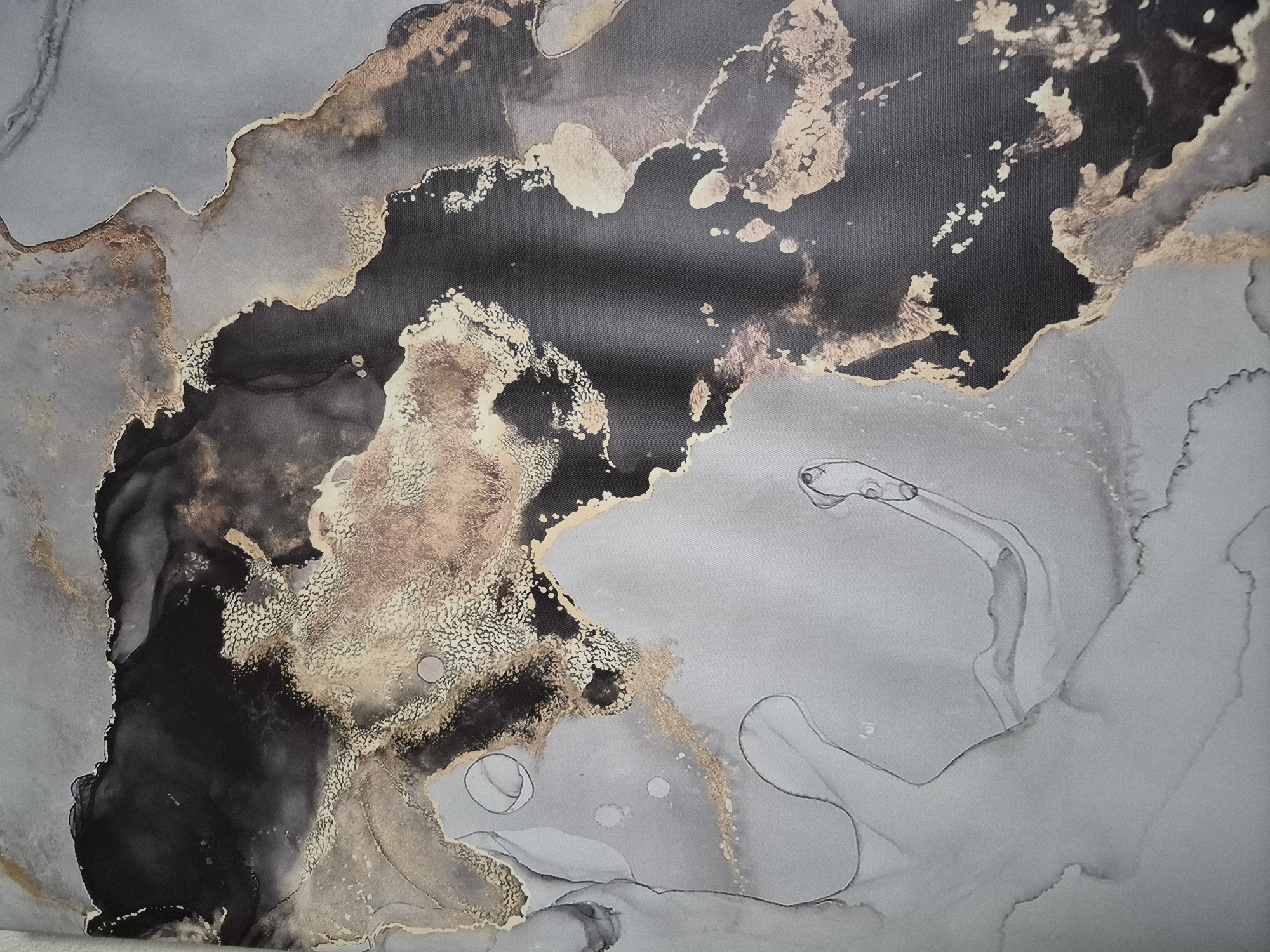 This media file presents an abstract artwork, likely an alcohol ink or fluid painting, distinguished by a dynamic interplay of dark gray/black, metallic gold/bronze, and various shades of light gray. The composition features expansive, irregular masses of deep dark gray or black, often bordered and interwoven with shimmering metallic gold or bronze elements. These metallic areas exhibit a rich, granular texture, suggestive of fine particles or a crinkled metallic surface.
The lighter gray sections function as a translucent backdrop, revealing delicate, flowing lines and soft washes that evoke the organic spread and movement of liquids. These lines create a sense of depth and ethereal quality, resembling ink channels, wispy clouds, or smoke. The overall impression is reminiscent of natural phenomena such as geological strata, swirling nebulae, or intricate fluid dynamics. The visible fabric texture in the detailed crops suggests the artwork is a painting or print on canvas.
There are no identifiable subjects, people, or specific events depicted within the abstract forms. No visible text is present in the image. This artwork is from Tobolsk, Russia.