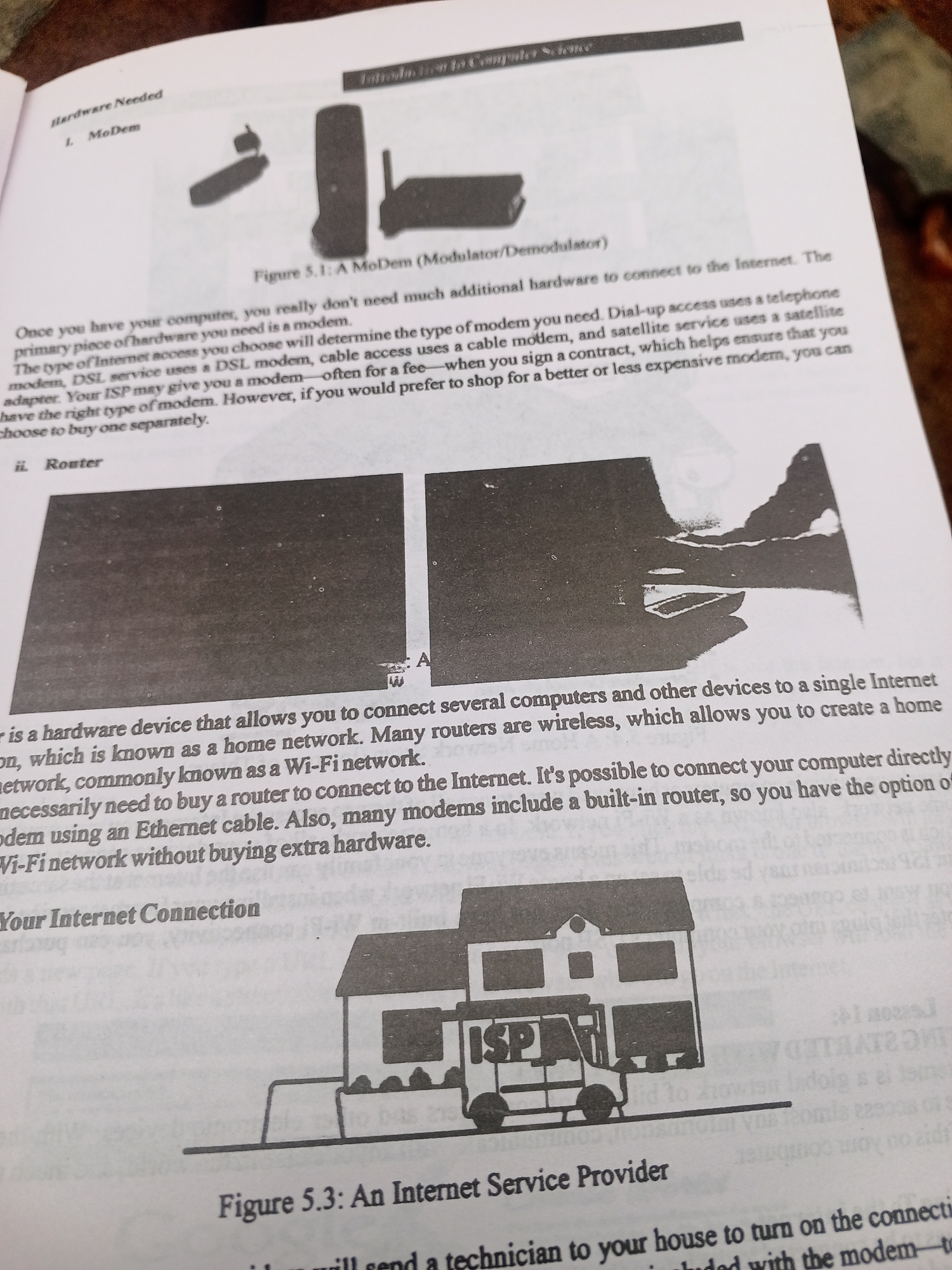 The image is a scan of a page from a book or manual, likely related to computer science or technology. The page discusses hardware needed to connect to the internet, specifically modems and routers.
The subjects are primarily objects. Figure 5.1 shows images of modems. Figure 5.3 is an illustration of a house with an "ISP" (Internet Service Provider) van parked outside, representing an internet service connection.
The text on the page describes the function of modems and routers, different types of modems (dial-up, DSL, cable, satellite), and how routers create home networks, including Wi-Fi networks. It also mentions that ISPs may provide modems and that some modems have built-in routers.
There are no people, specific time of day, weather, or strong emotional cues visible in the scanned page. The location context of Jalingo, Nigeria, is not evident from the image content itself. The setting is a printed page with illustrations and text.