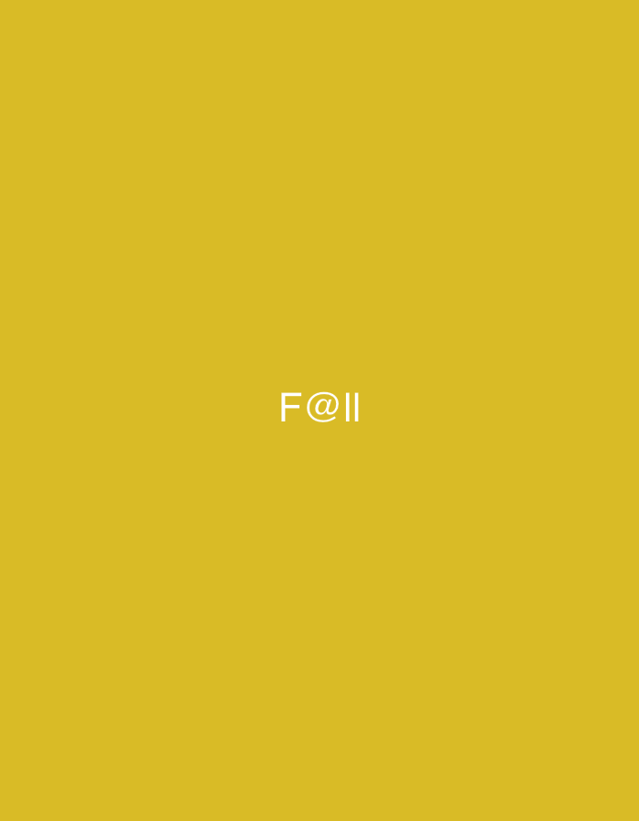 The image displays a solid golden yellow background. In the center of the frame, the white text "F@ll" is visible. There are no other objects, people, or environmental features present in the image. This image does not contain any information that can be used to locate it in Casablanca, Morocco.