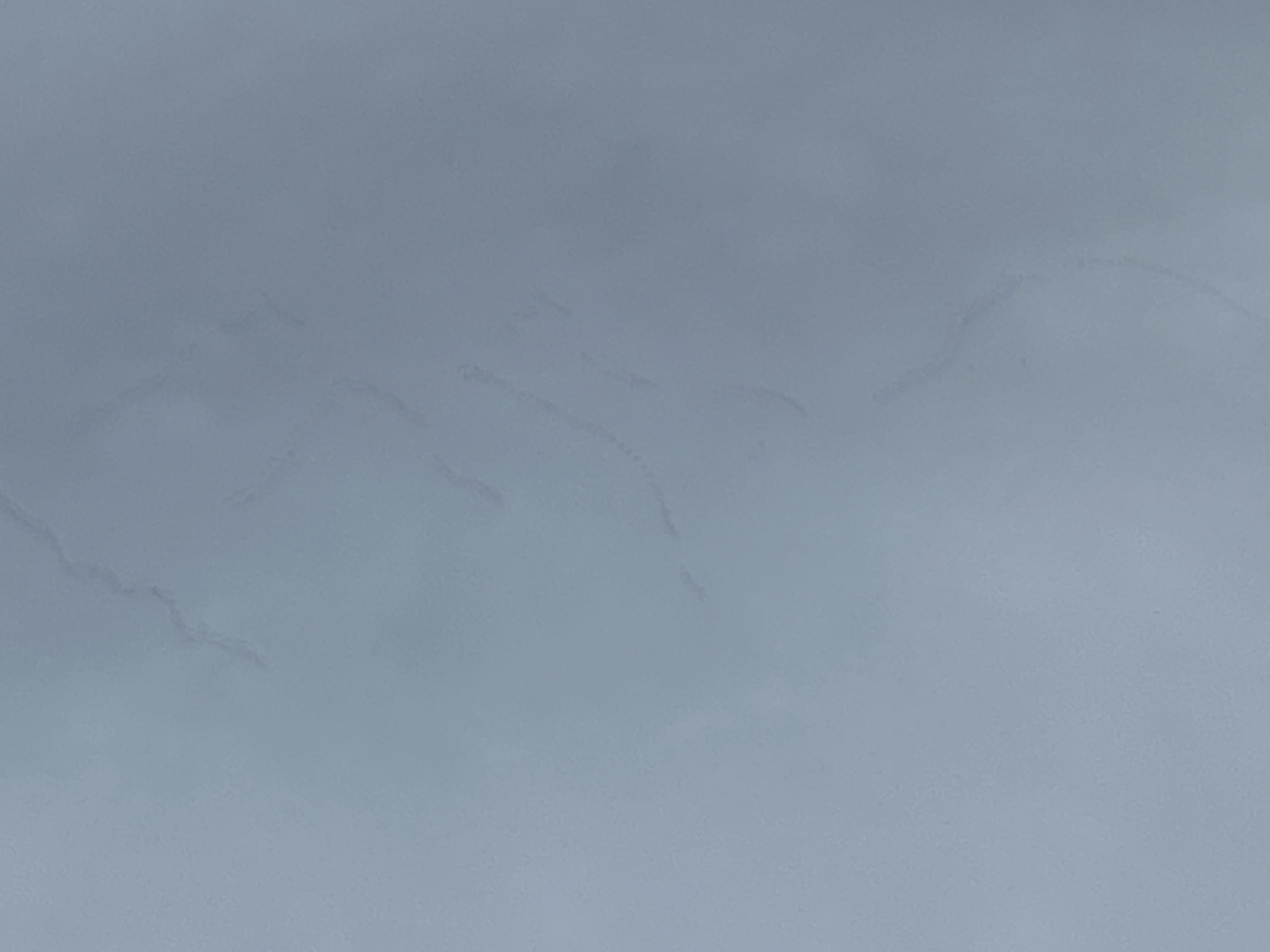 The image shows a grey, slightly textured surface, possibly a wall or ceiling. There are subtle, faded lines or streaks across the surface, suggesting water stains or imperfections in the material. The location in Rutherglen, United Kingdom, and any information about people, subjects, objects, actions, interactions, or the environment are not discernable from the provided image.