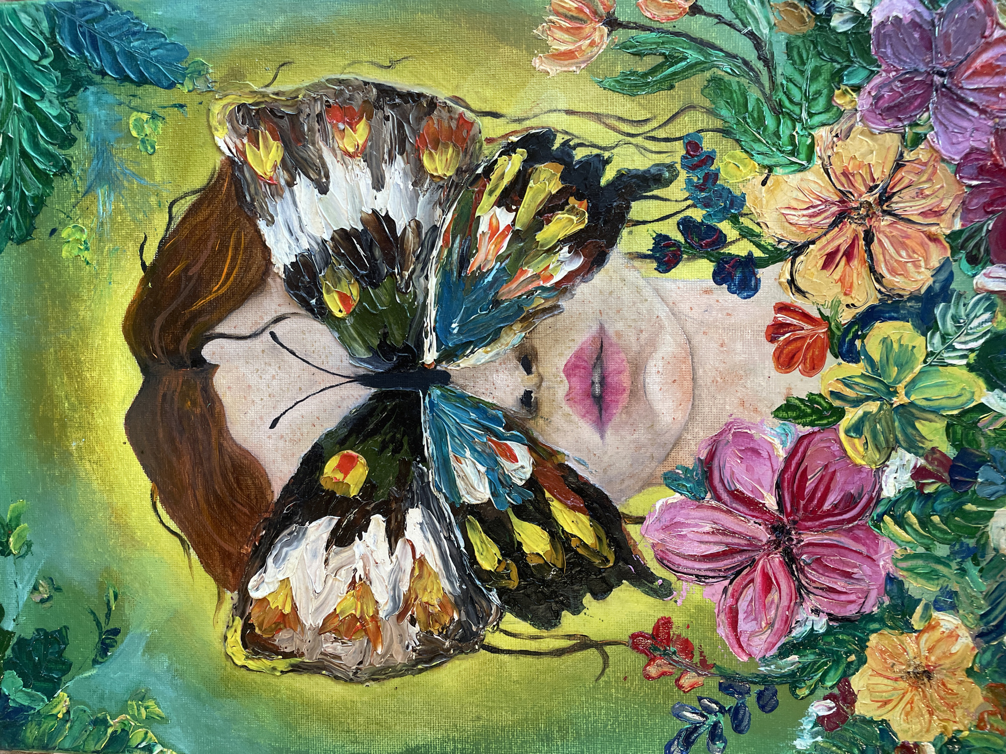 A painting displays a woman's face partially obscured by a butterfly and surrounded by flowers and greenery. The woman has brown hair, pale skin, and pink lips. A large butterfly with detailed, colorful wings covers a portion of her face. The butterfly's wings feature colors like white, black, brown, yellow, blue, and orange. Flowers in shades of pink, orange, purple, and red are clustered around the woman's face, interspersed with green leaves. The background consists of a blend of green and yellow hues, possibly representing a garden or natural environment. The painting style is expressive, with thick brushstrokes. There is no indication of this picture being in Debelt, Bulgaria.