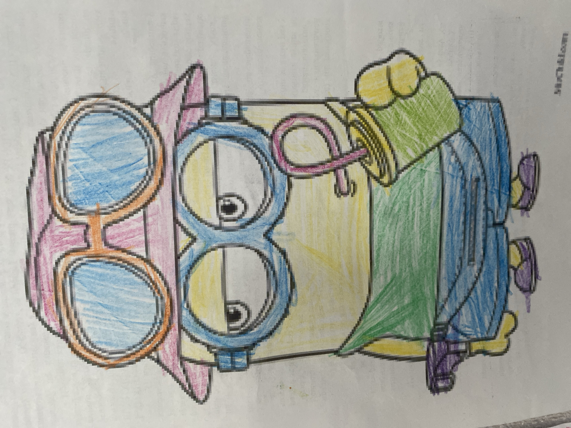 A hand-drawn, colored illustration of a Minion-like character is centered on a white sheet of paper. The character has a yellow body and is depicted wearing a pink bucket hat with an orange brim, positioned above large blue-lensed goggles with orange frames. Below these, the character wears its characteristic blue goggles over its two visible eyes, which have black pupils and a somewhat neutral expression, looking slightly to its left. The Minion wears a green short-sleeved shirt and blue shorts. In its right hand (viewer's left), it holds a small purple object resembling a toy gun. In its left hand (viewer's right), it holds a green cup with a yellow rim and a pink, looping straw, with a small yellow detail near the straw. The character's feet are adorned with purple shoes. The coloring exhibits visible crayon or colored pencil strokes, and the background is a plain white paper surface with faint, pixelated text visible in the bottom right corner of the original image. Location: Unknown, Unknown.