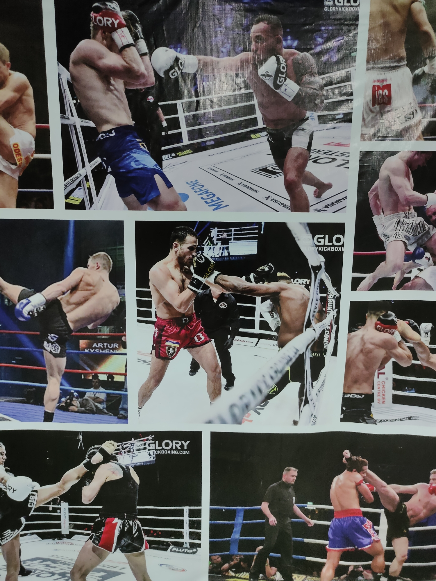 This media file is a collage of images depicting kickboxing matches, likely from the GLORY Kickboxing organization, as indicated by visible text. The subjects are male athletes in combat gear, including shorts and gloves, engaged in fighting. The setting for all images is a kickboxing ring, characterized by ropes, corner posts, and a mat floor.
The activities shown include striking, blocking, and kicking, characteristic of kickboxing. Some images capture moments of intense action, with athletes in dynamic poses. One image features a referee overseeing a match, dressed in a black shirt and pants. The background of the images suggests an indoor arena with audience members visible in some shots.
Notable details include the brand name "GLORY" prominently displayed on gloves and in the background. Text such as "GLORYKICKBOXING.COM", "MEGAZONE", "ARTUR KYSNENKO", "CHICKEN CENTRE BY", and "PLUTO" are also visible. The lighting suggests an indoor event, typical for professional sports. The emotions conveyed are of focus and intensity on the part of the athletes. The specific location context of Comrat, Moldova, is provided but not explicitly evident within the visual content of the collage itself.