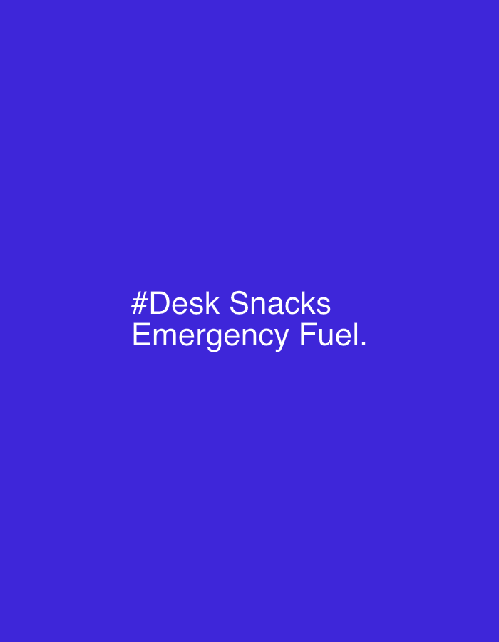The image features white text on a blue background. The text reads "#Desk Snacks Emergency Fuel." There is no indication of the location of Chaikovsky, Russia or any other specific location, people, objects, actions, interactions, or environment beyond the text and background color.